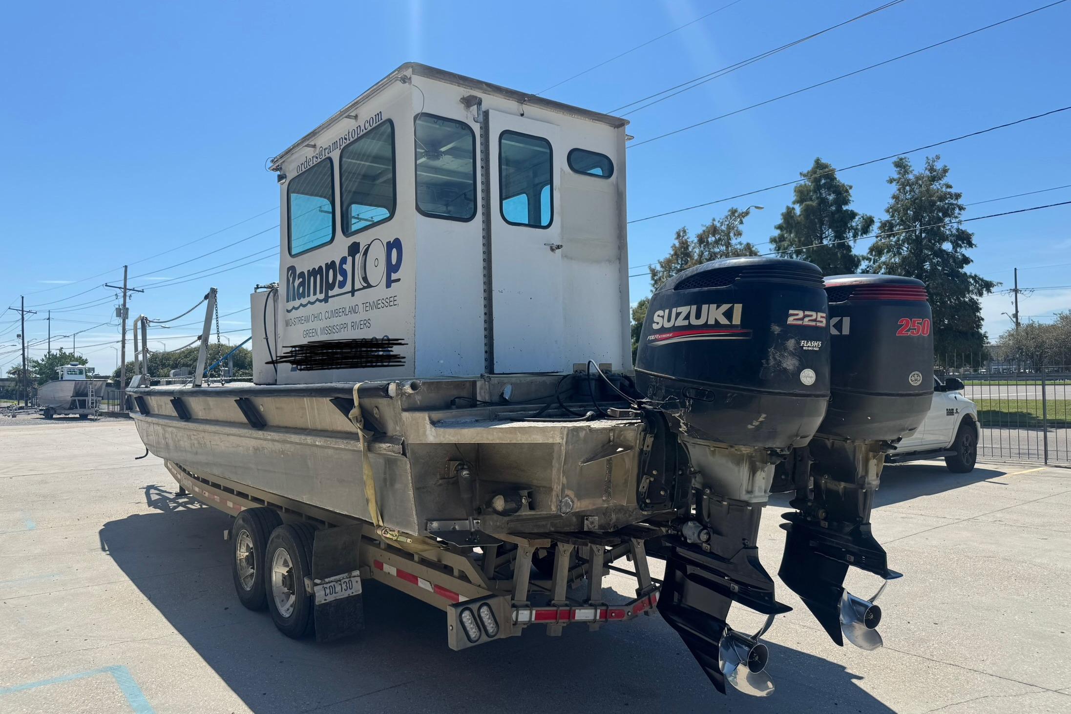 Custom Aluminum Work Boat 33, 2010 model, with dual Suzuki outboard motors.