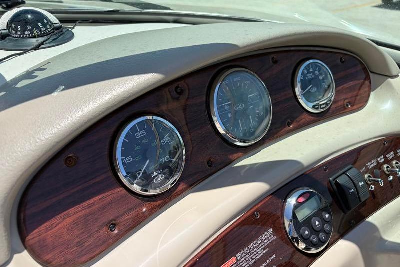 Dashboard of a 2007 Sea Ray 240 Sundeck boat with gauges and controls.