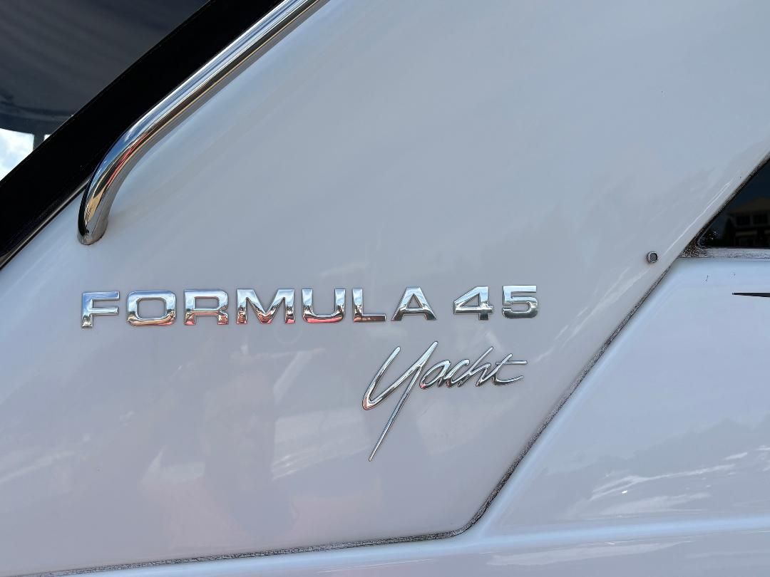Close-up of the "Formula 45 Yacht" lettering on a white boat hull.
