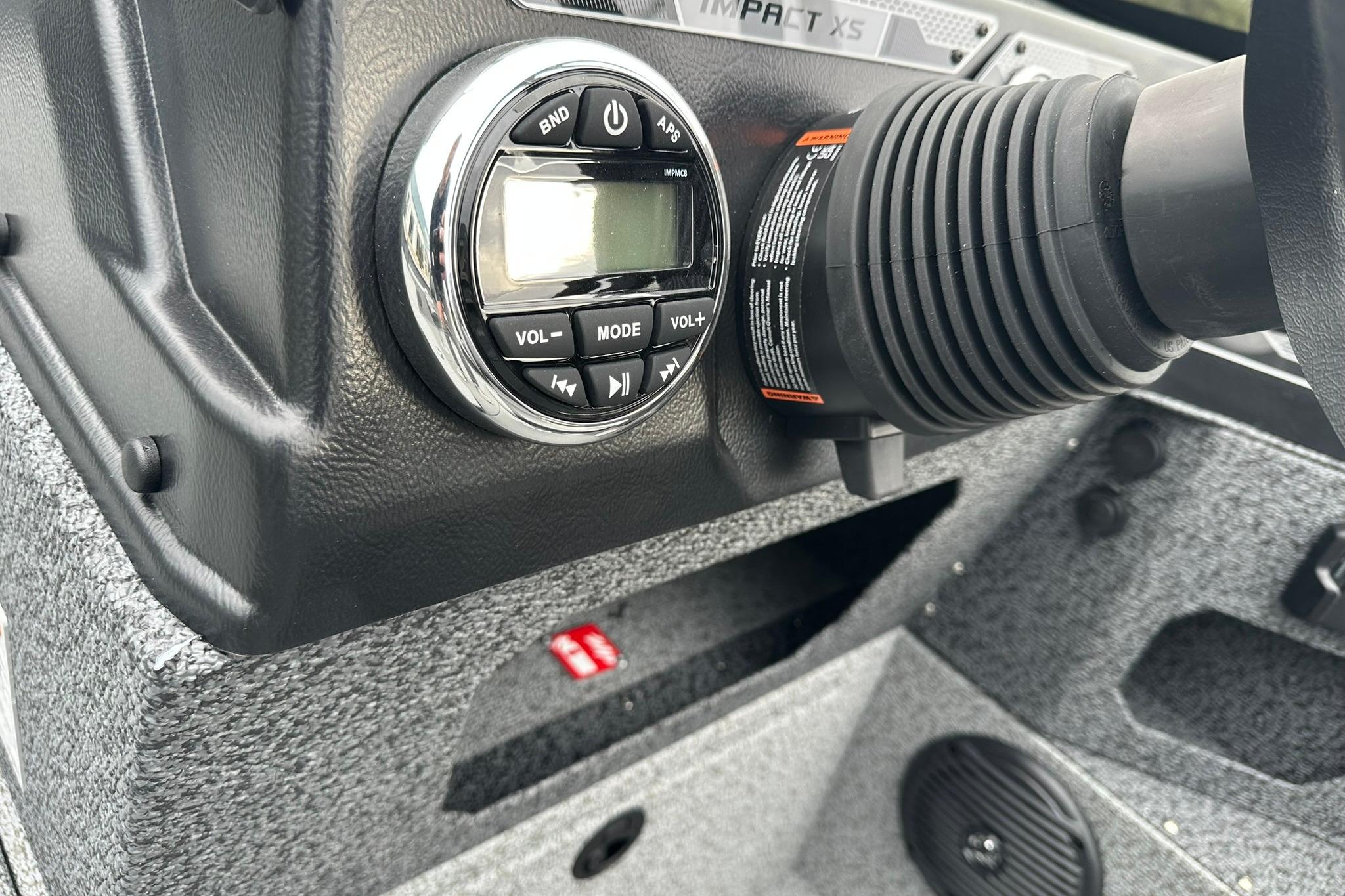 2026 Lund 1875 Impact XS SS dashboard with audio controls and steering wheel detail.