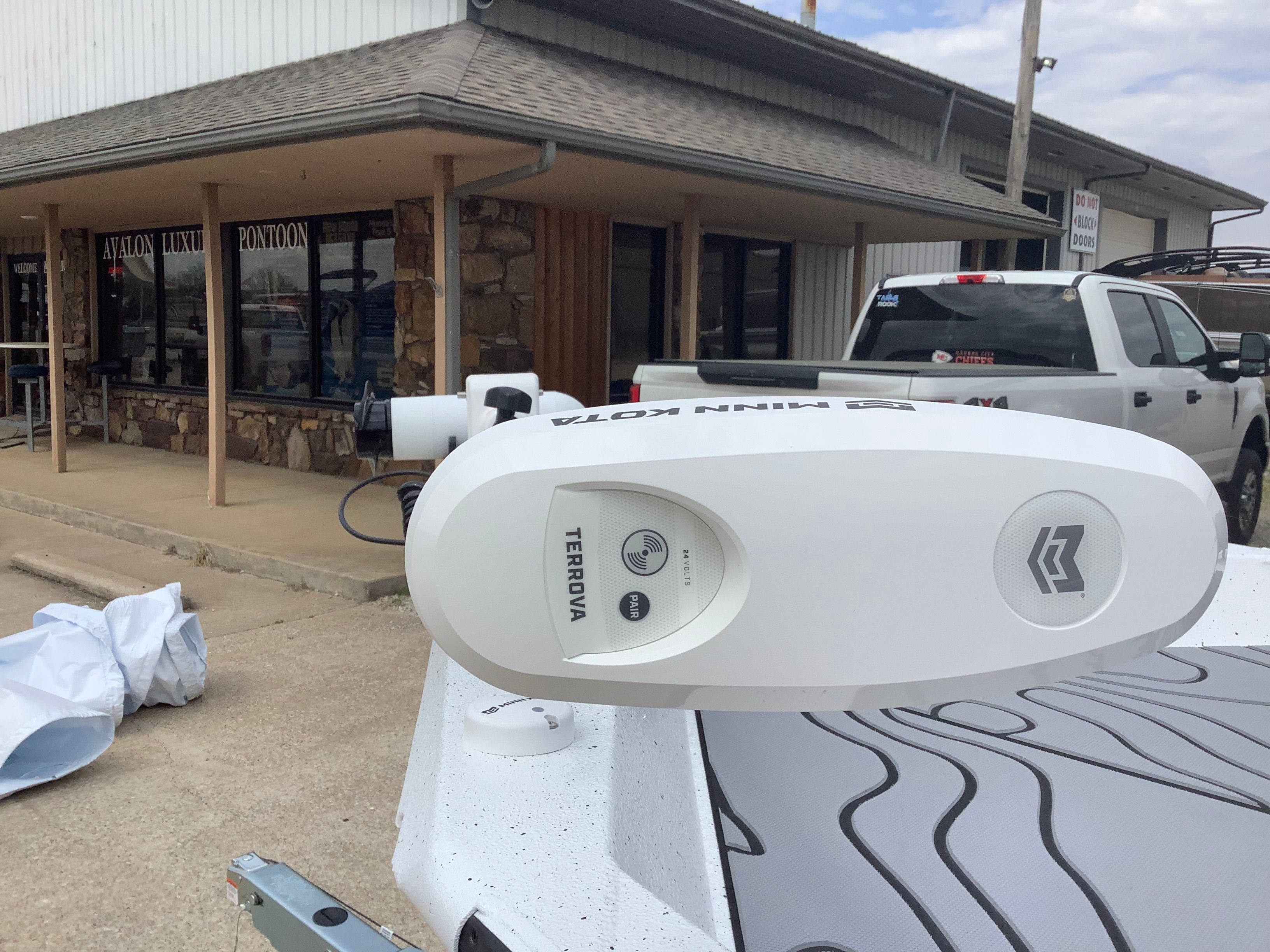Minn Kota Terrova on Xpress H22B Bay 2026 outside store.