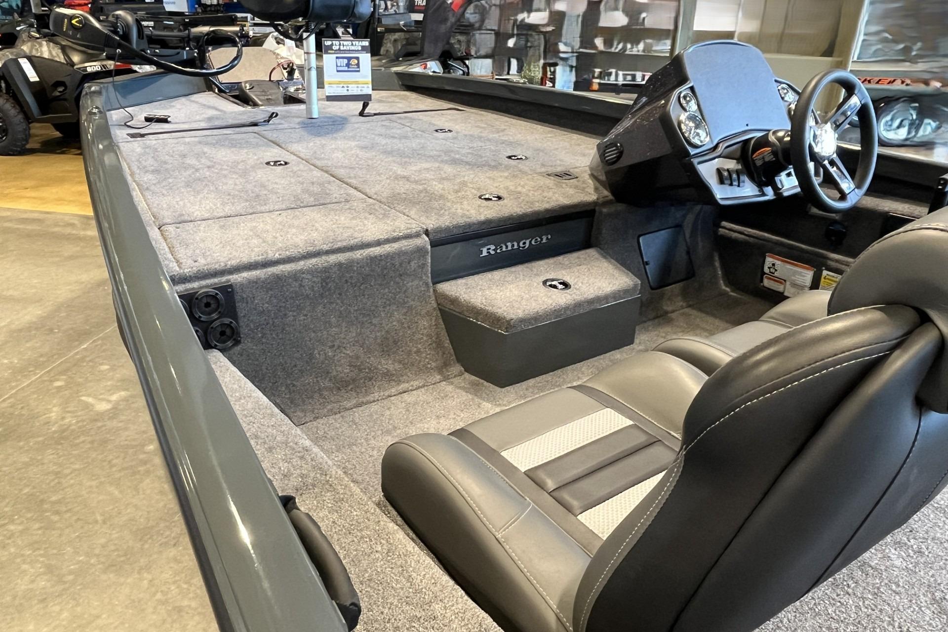 2026 Ranger RT188P boat interior with steering wheel and seating, showcasing spacious design.