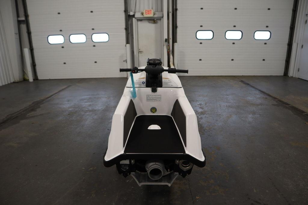 2025 Yamaha WaveRunner SuperJet in a garage, rear view showcasing sleek design.