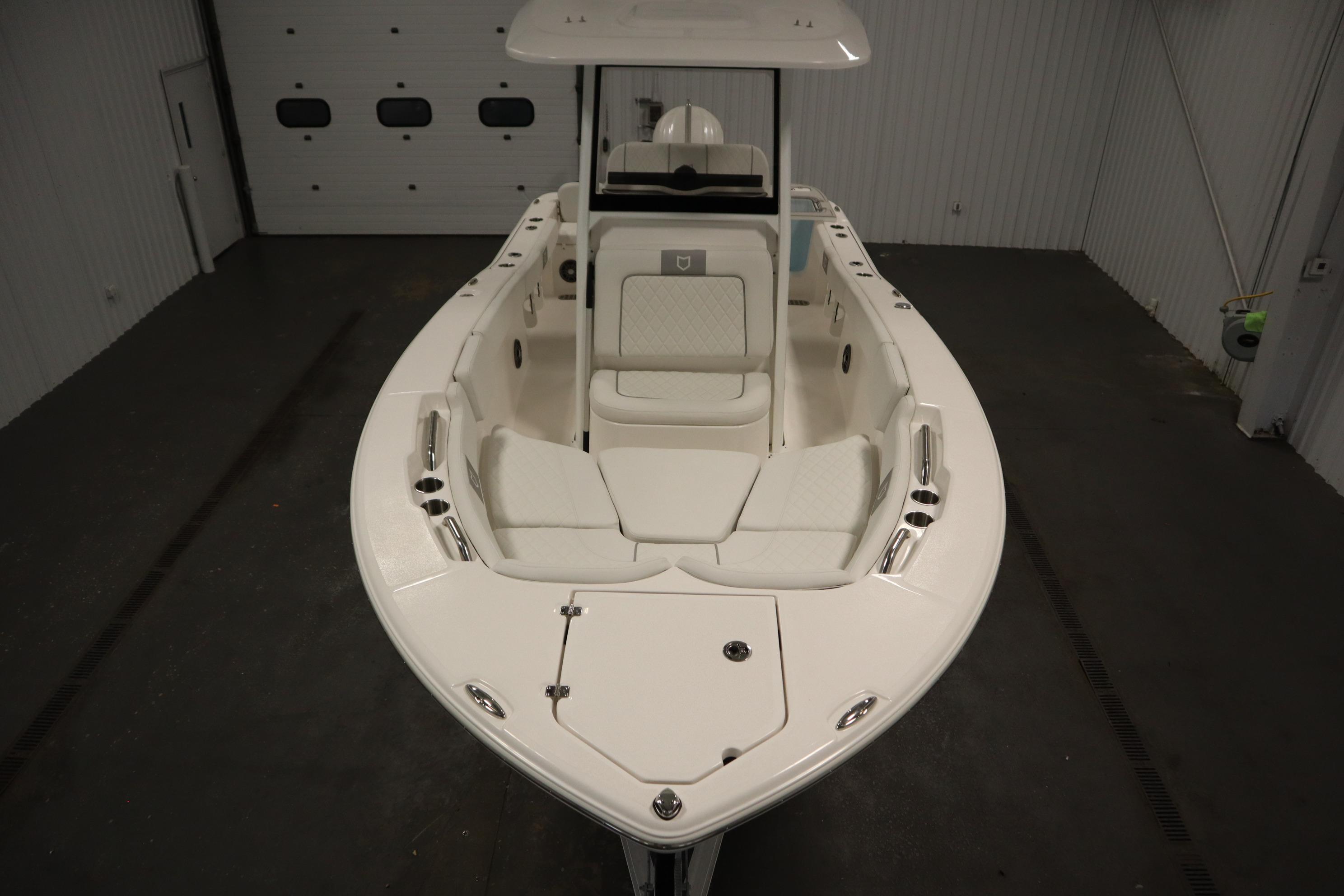 2026 Sea Fox 228 Commander boat in indoor storage, showcasing sleek design and spacious seating.
