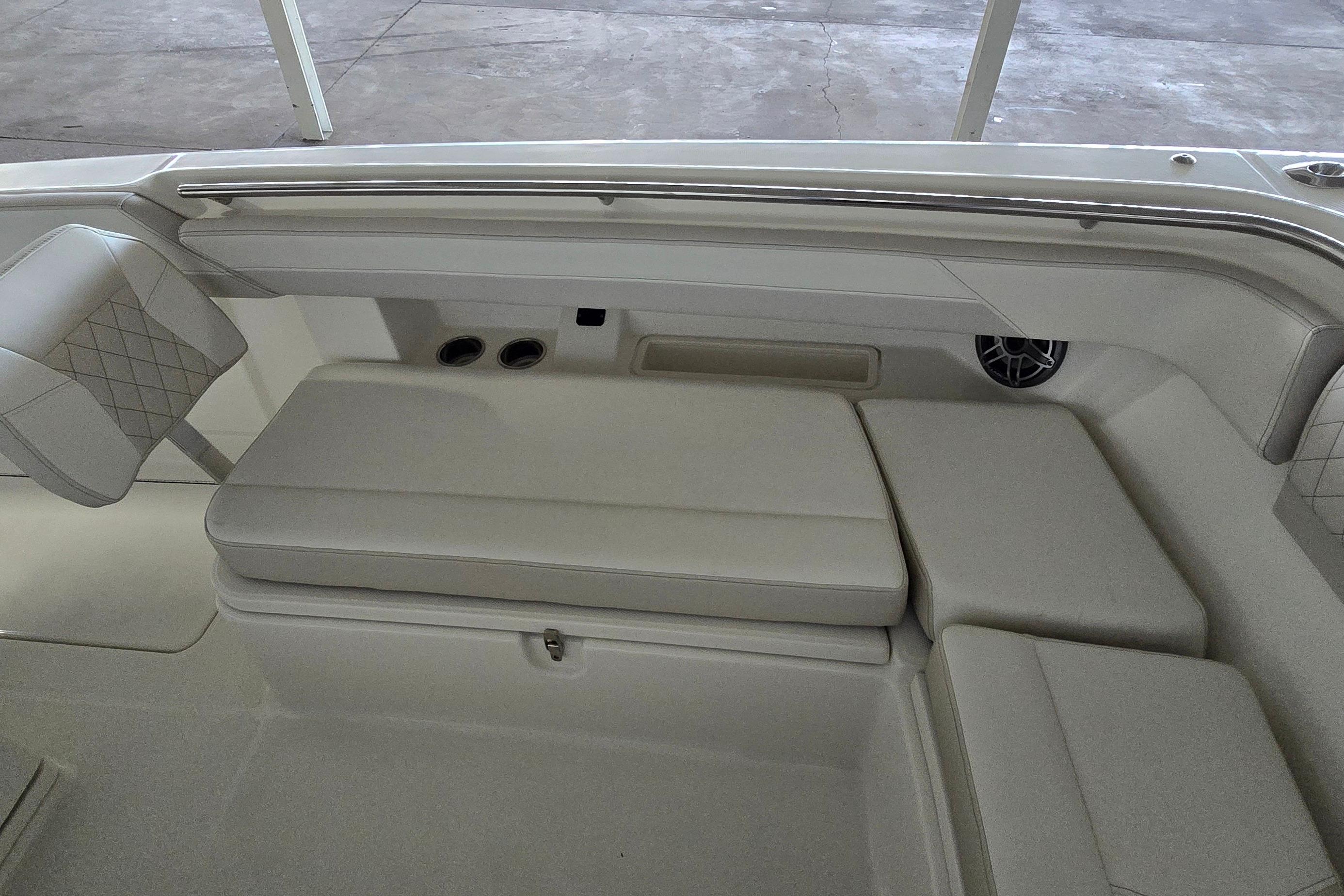 2024 WorldCat 280 CC-X boat interior with cushioned seating and speaker system.
