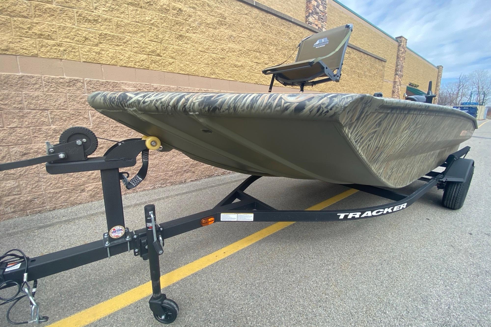 2026 Tracker Grizzly 1756 T Marsh boat on trailer, parked outdoors.
