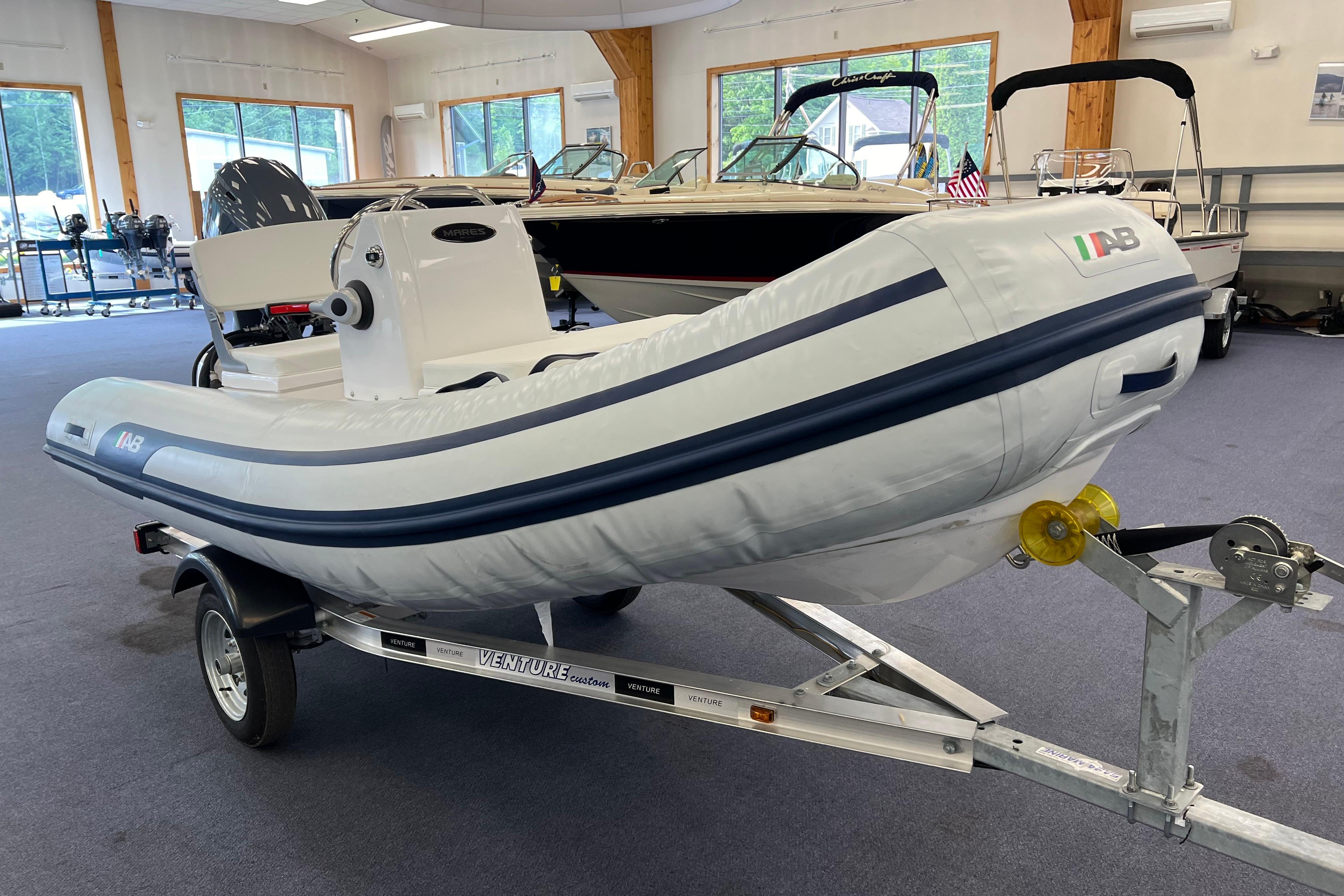 2023 AB Inflatables Mares 12 VSX boat on trailer in showroom.