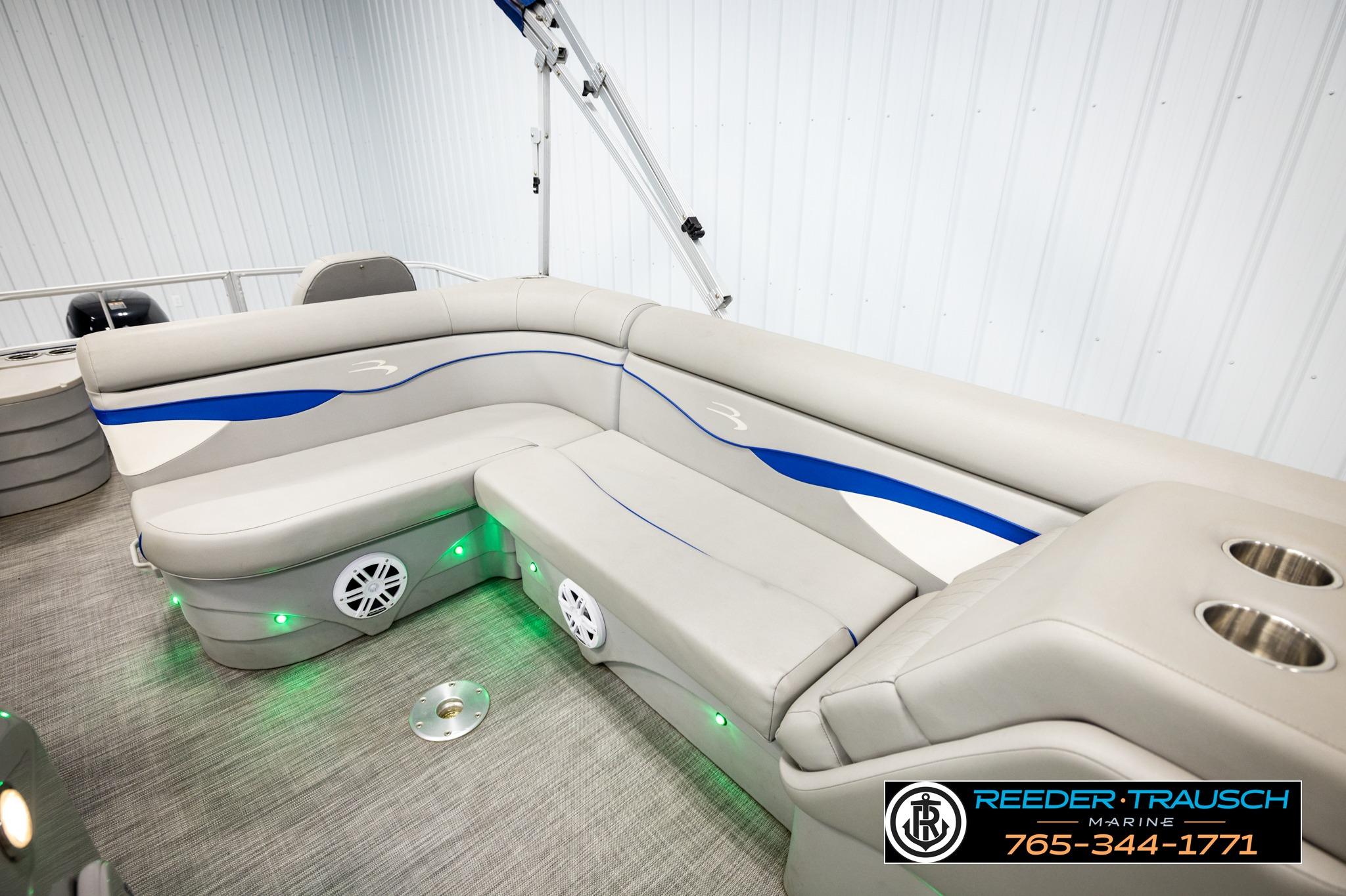 2021 Bennington 20 SV pontoon boat interior with plush seating and cup holders.