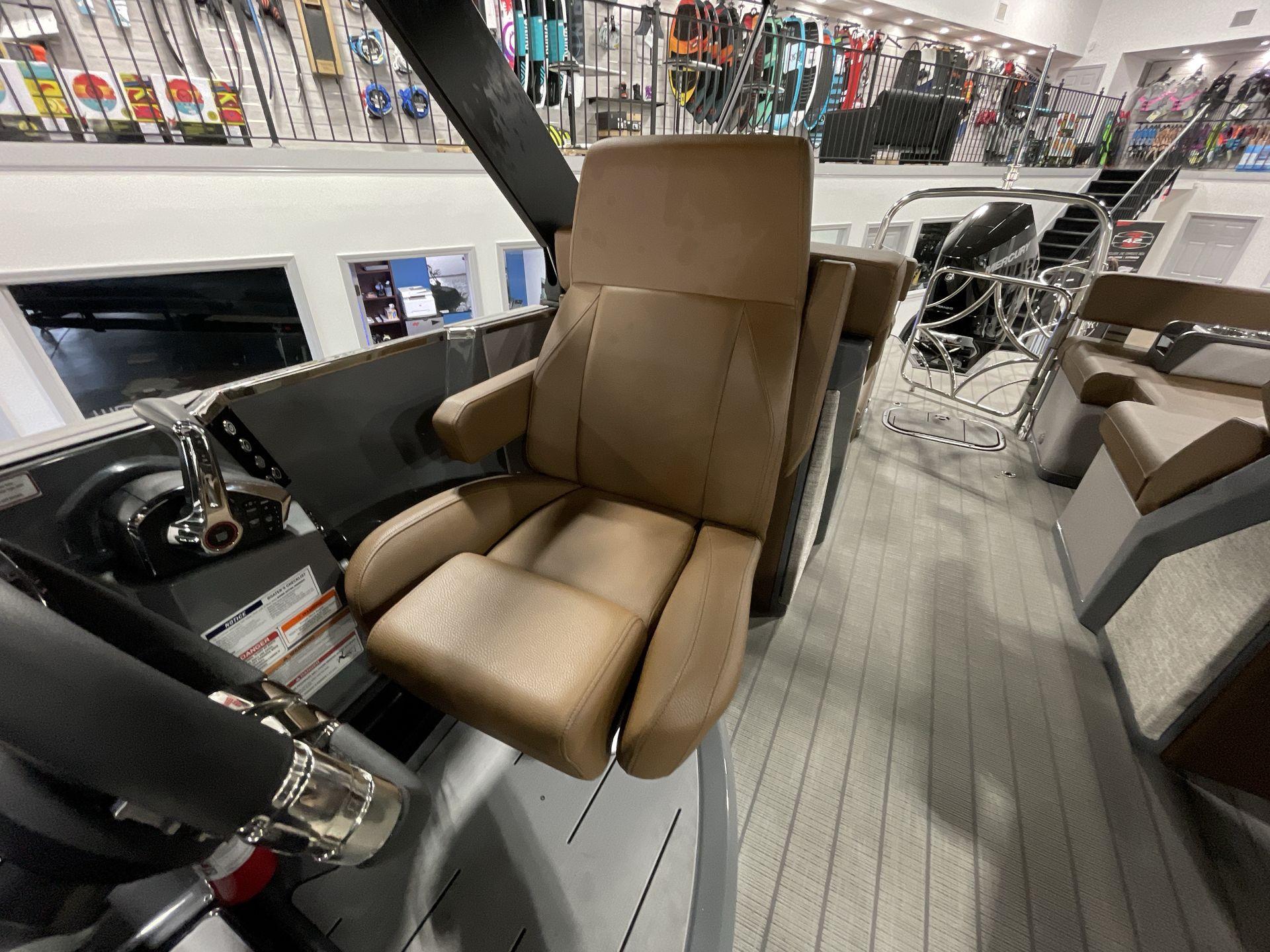 Captain's chair on 2025 Balise Horizon 26C boat, featuring luxurious brown upholstery.