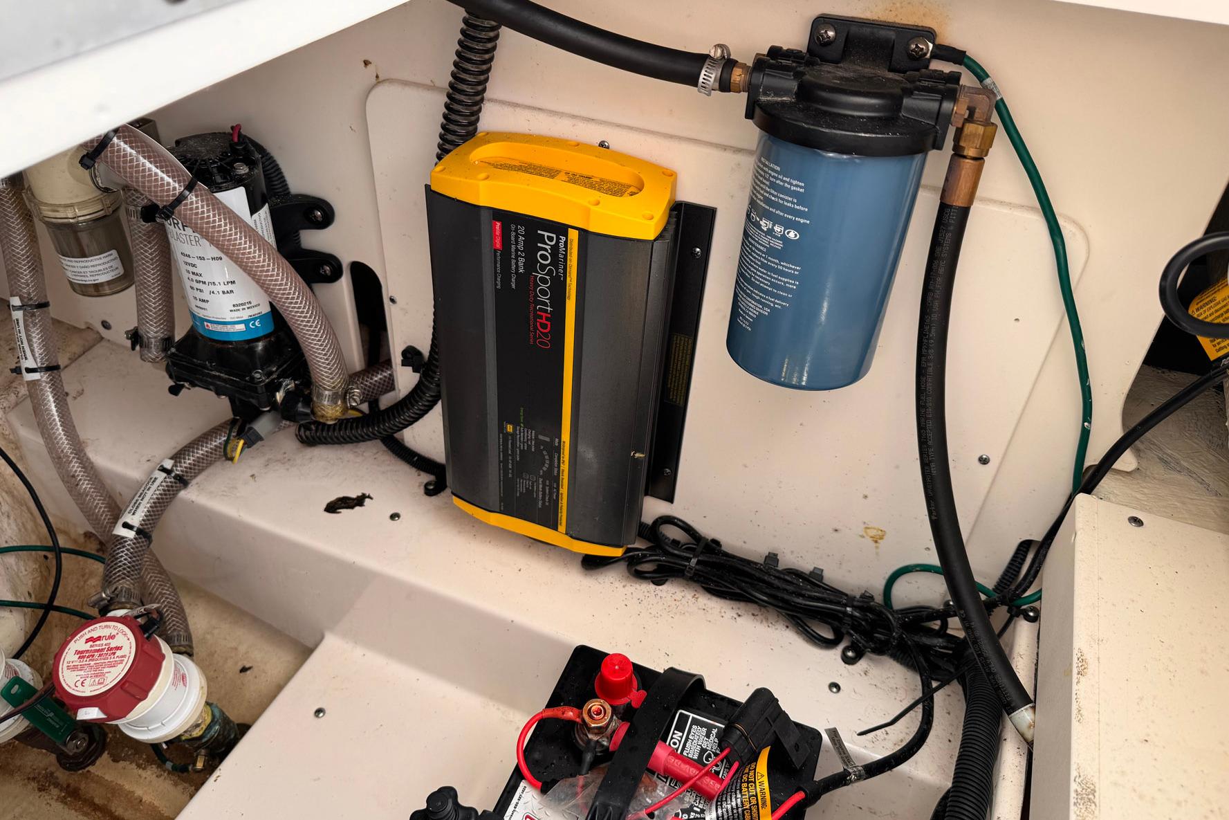 Electrical and plumbing components inside a 2021 Robalo 246 Cayman boat.