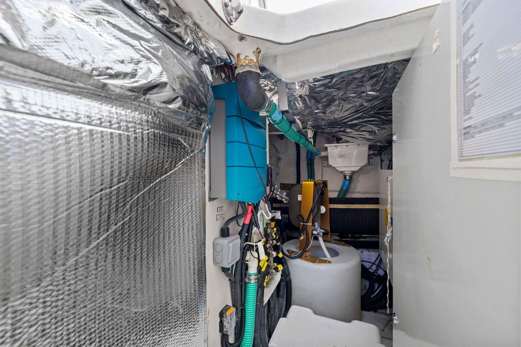 Engine room of 2015 Princess 60 Flybridge Motor Yacht with insulated walls and equipment.