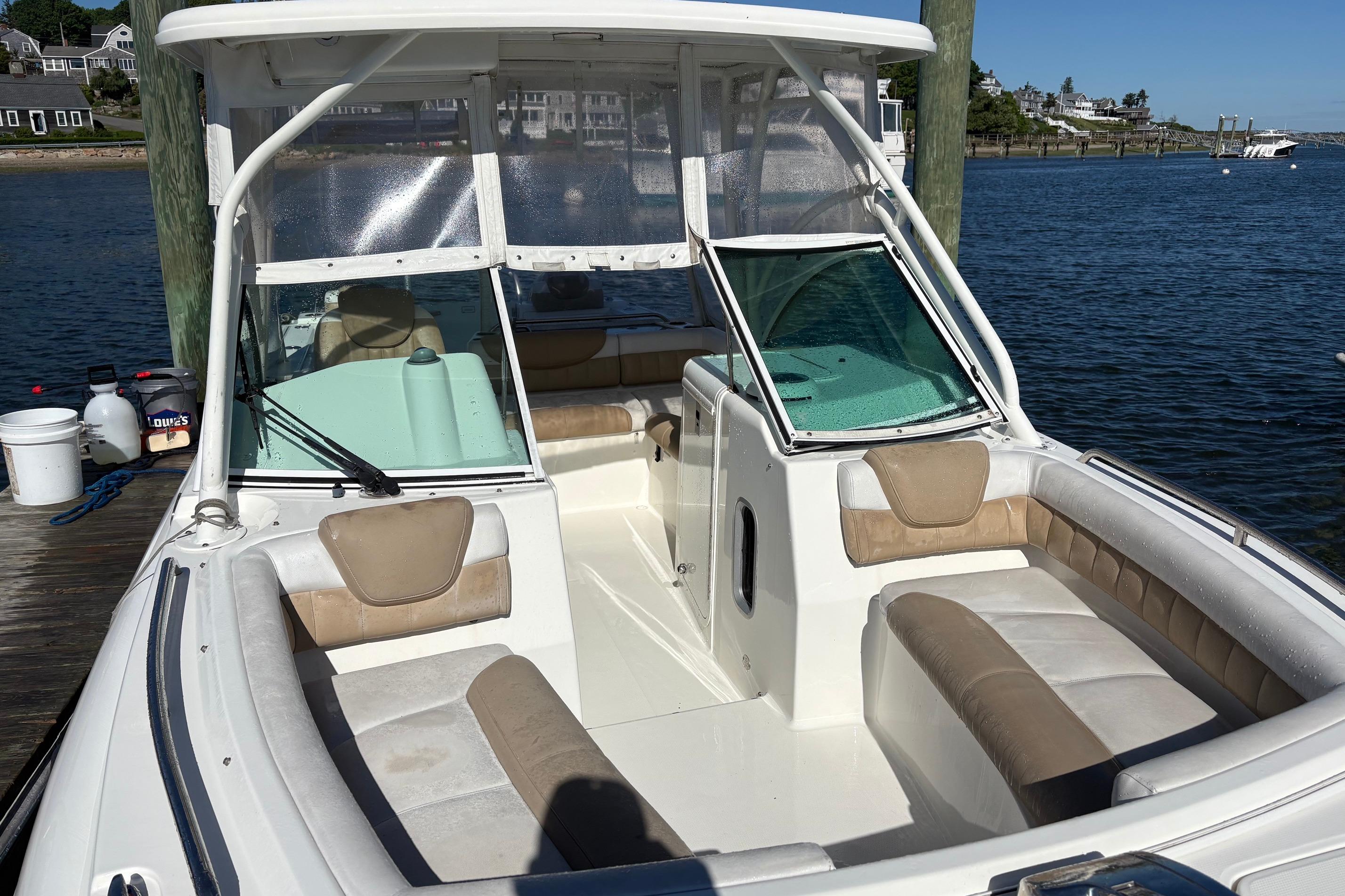2016 Glacier Bay 2740 Dual Console boat docked by the water.