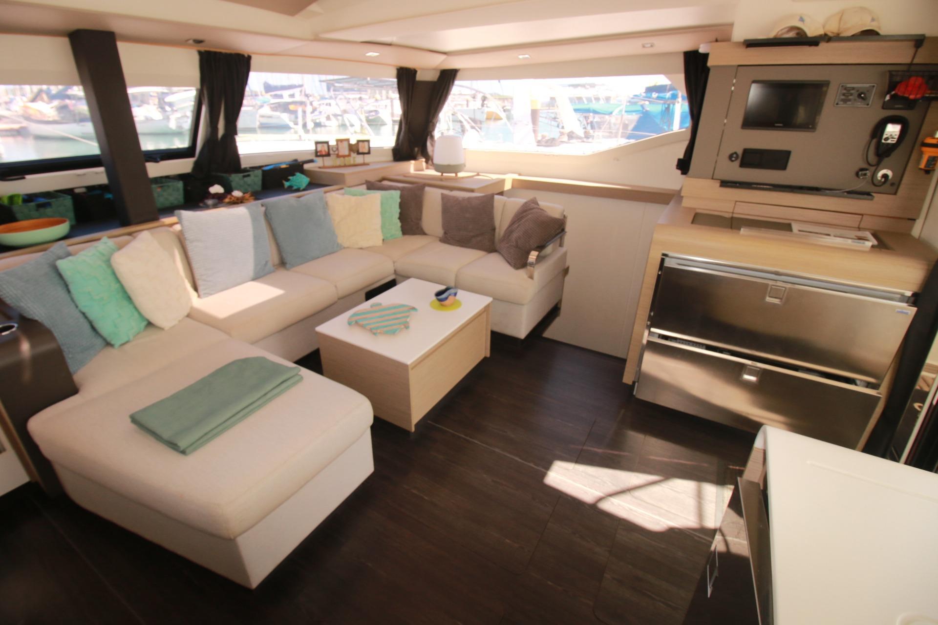 Luxurious interior of 2022 Fountaine Pajot Elba 45 Catamaran with modern seating and navigation area.