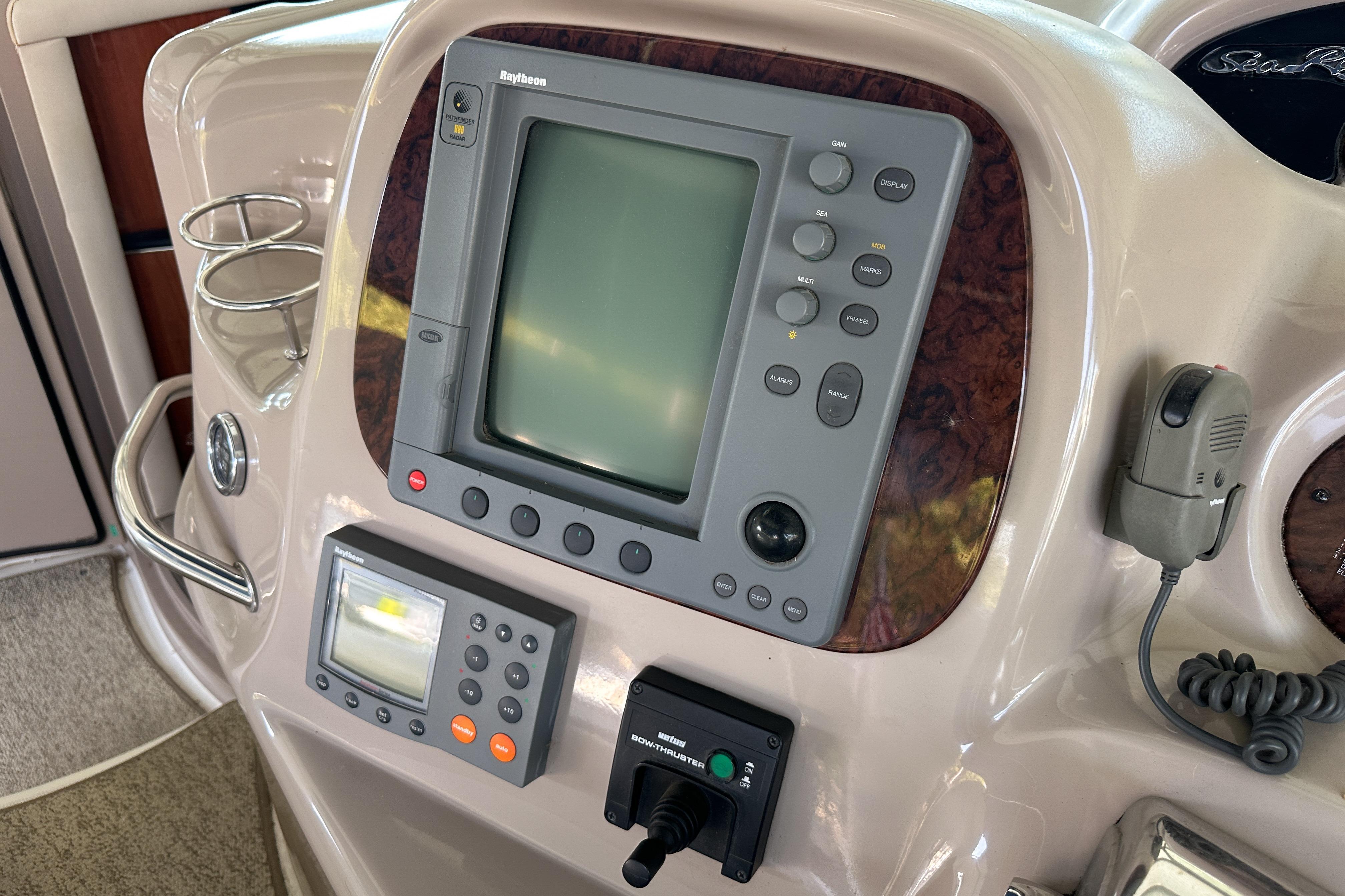 Control panel of a 2001 Sea Ray 410 Sundancer boat with navigation equipment.