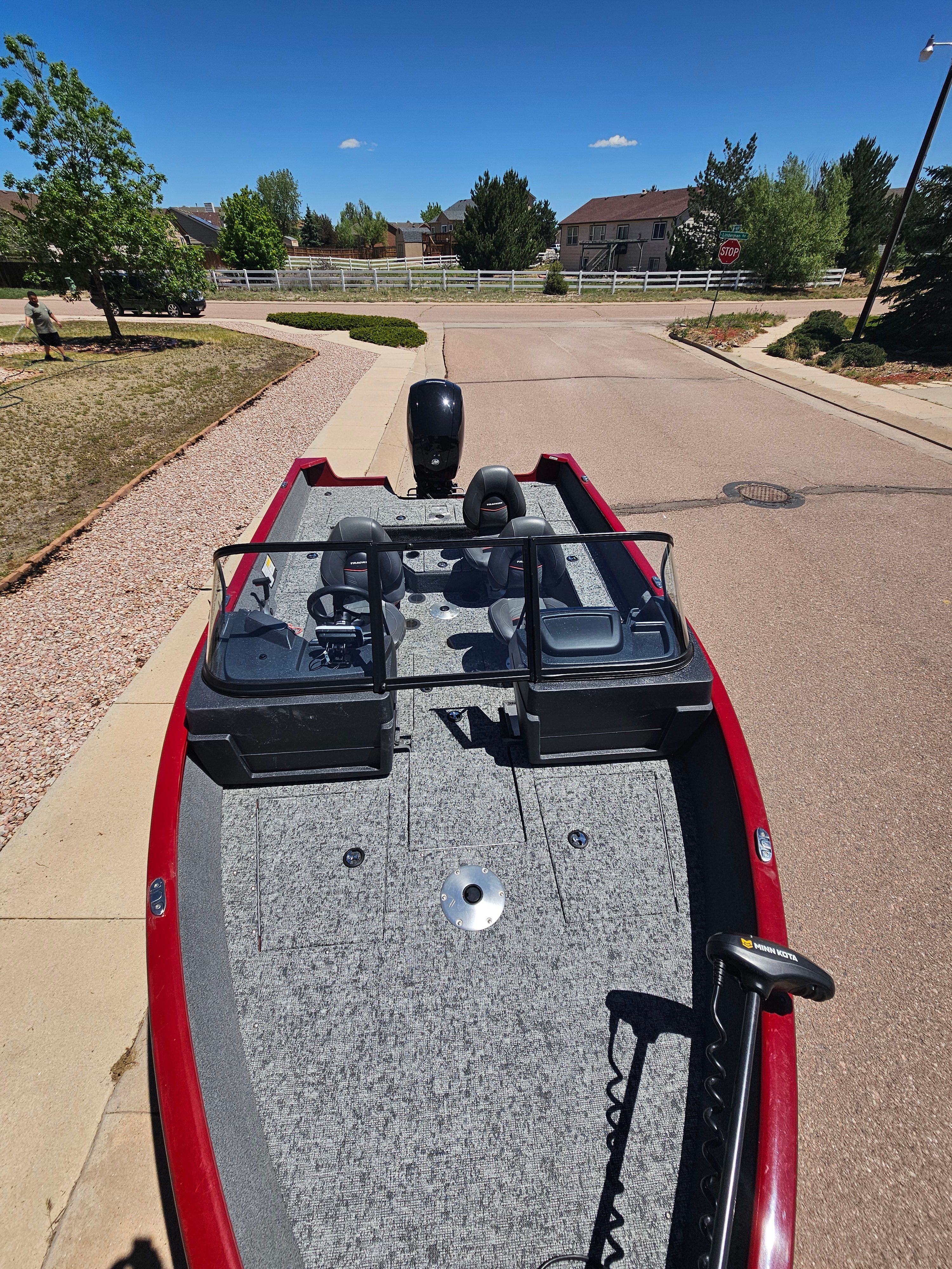 2021 Tracker Pro Guide V-175 WT boat parked on a street.