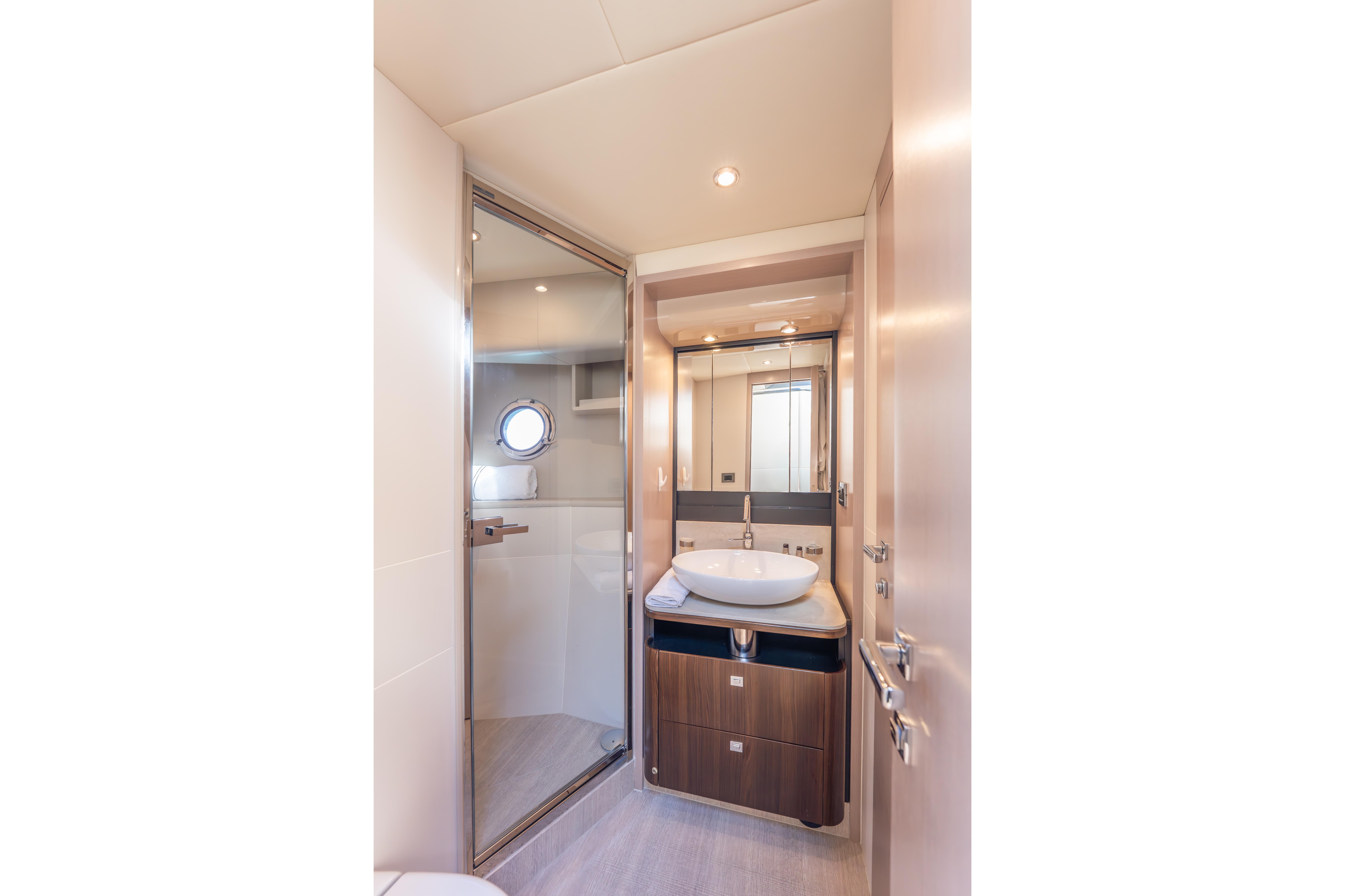 Luxurious bathroom interior on 2019 Absolute 58 FLY yacht, featuring modern fixtures and elegant design.