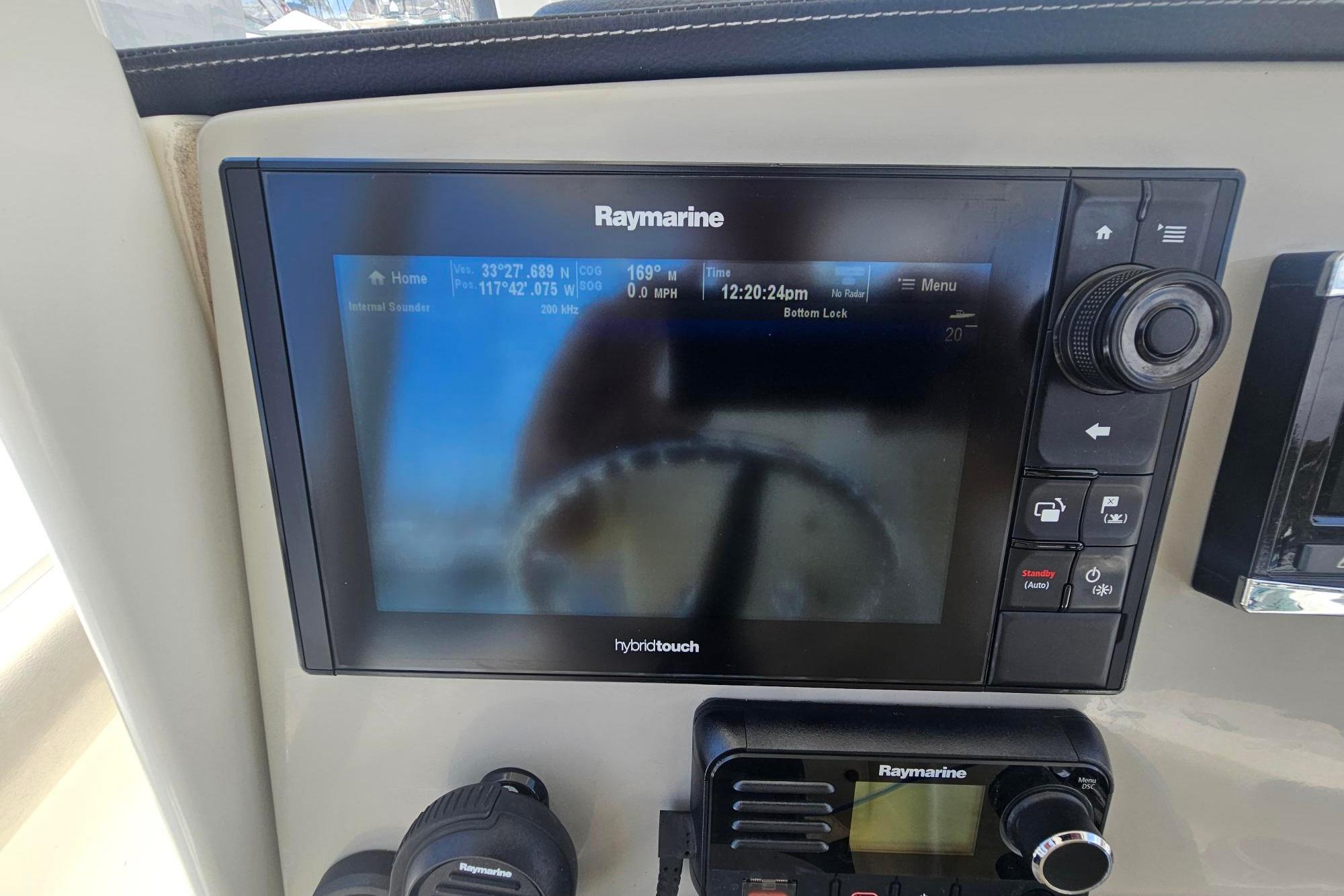 Raymarine navigation system on 2017 Boston Whaler 230 Outrage boat dashboard.