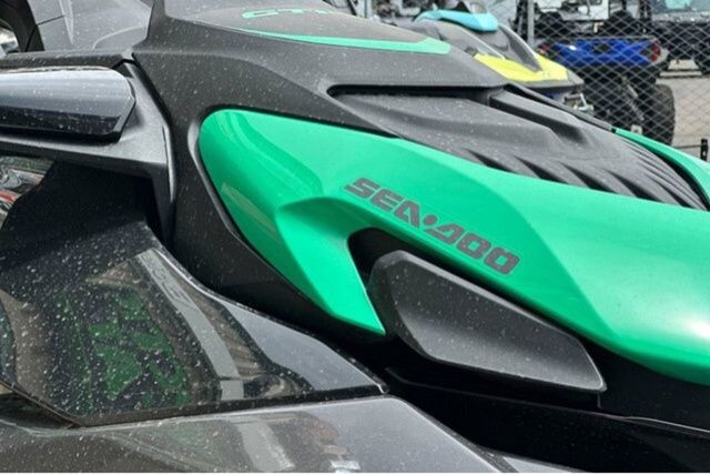 Close-up of a Sea-Doo PWC GTR 230 with green and black design.