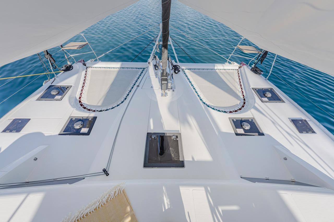 Deck of Privilege Signature 510 catamaran, 2025 model, on calm water.