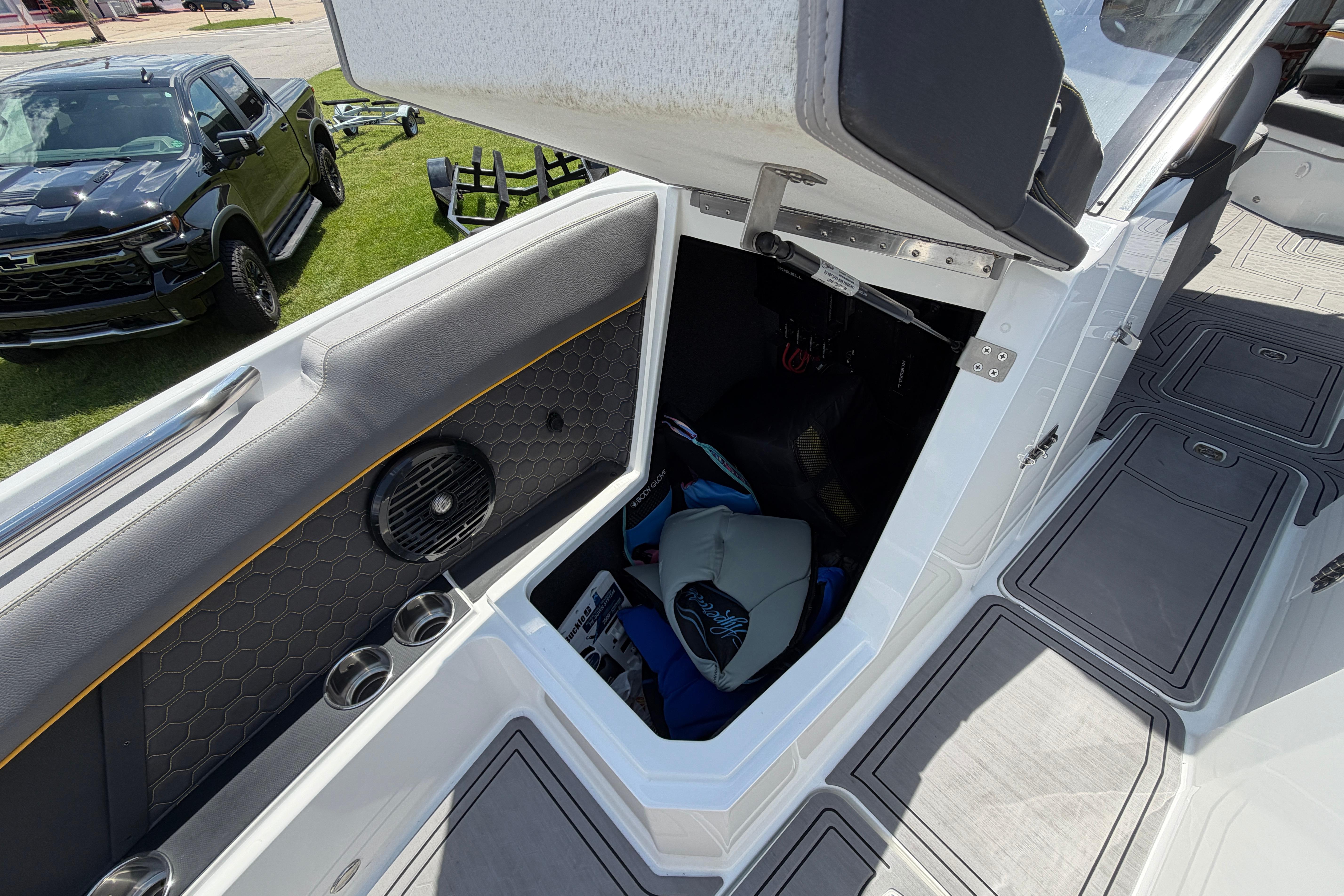 2021 Cobalt R8 Surf boat interior storage compartment with open hatch and visible gear.