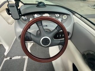 The image shows the cockpit of a 2004 Chaparral 190 SSi with a wooden steering wheel.