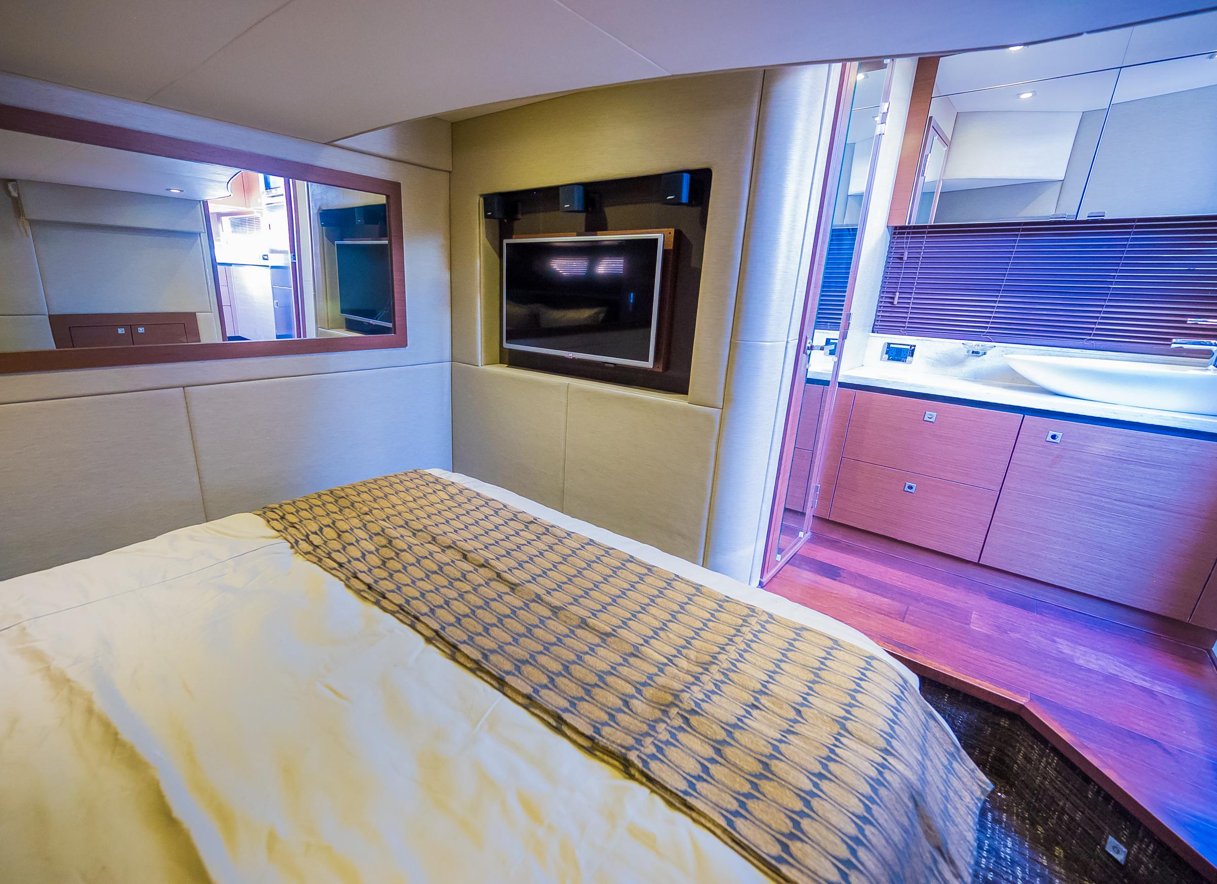 Luxurious bedroom interior of 2015 Sea Ray Sundancer 510 yacht with modern amenities.