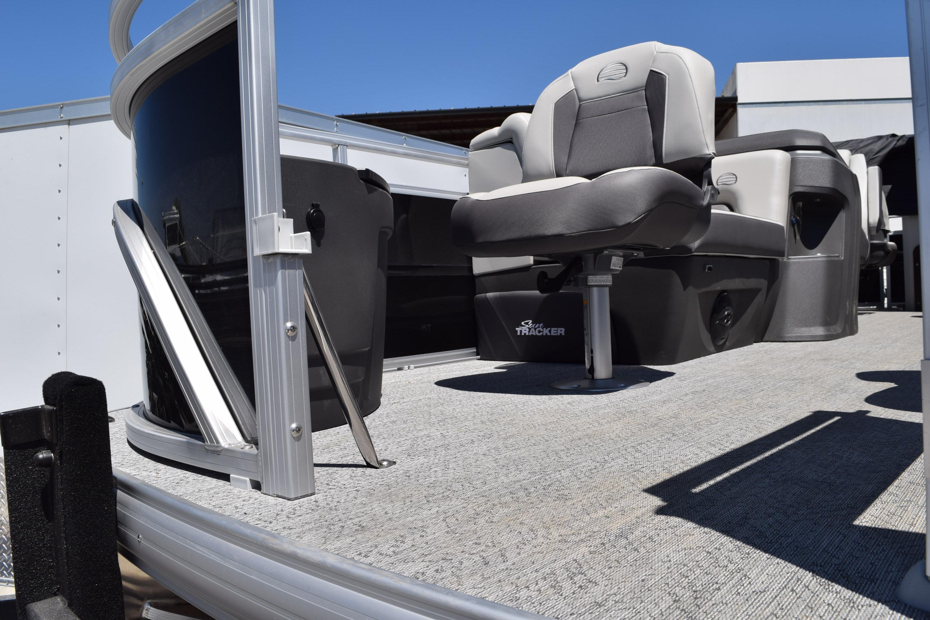2026 Sun Tracker Fishin' Barge 20 DLX pontoon boat with comfortable seating and modern design.