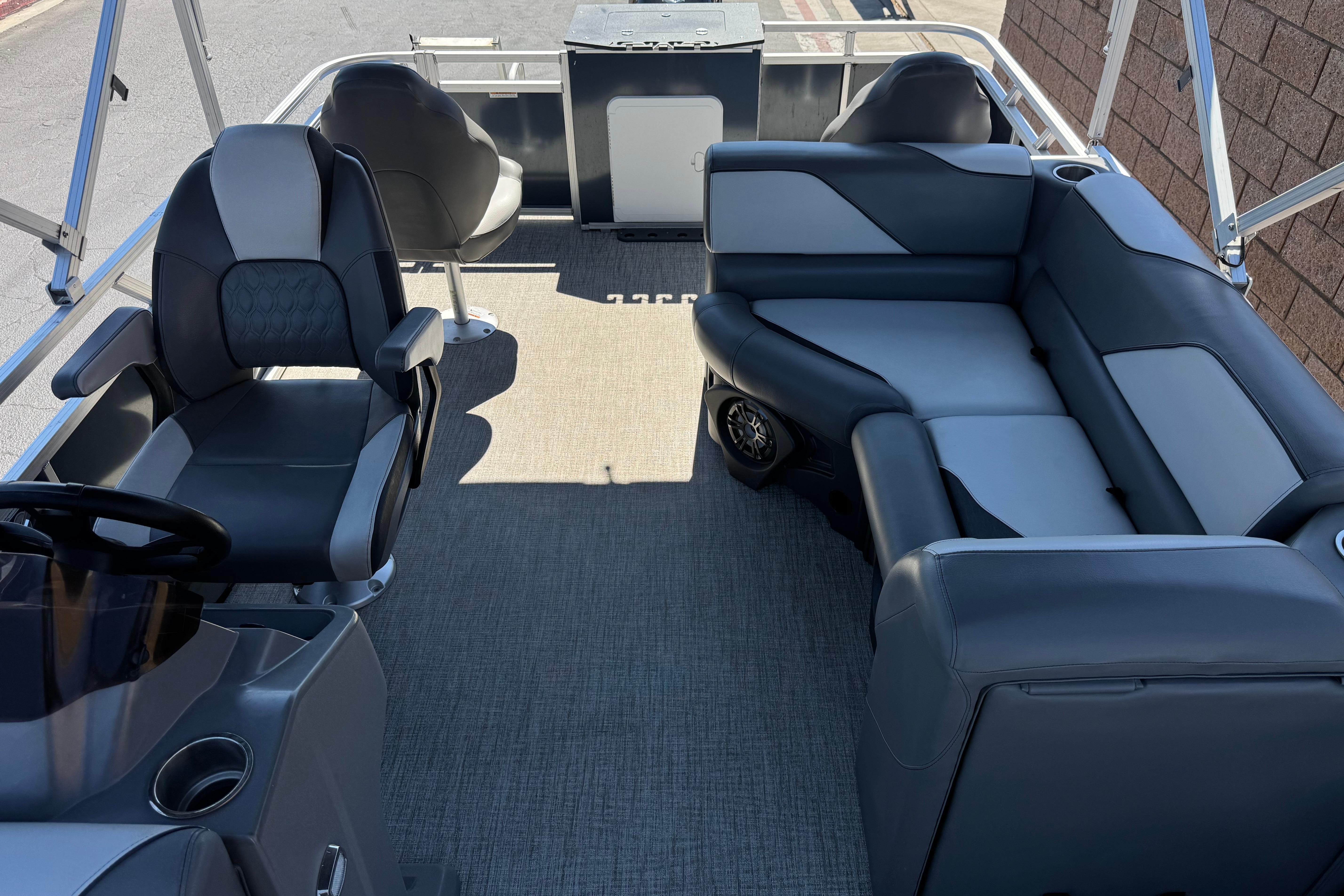 2023 Avalon Venture Fish N Cruise 20' interior with gray seating and steering console.