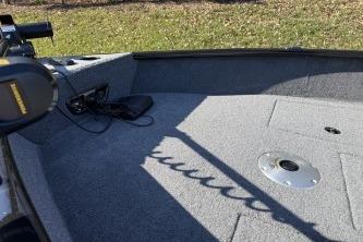 2026 Tracker Pro Guide V-175 Combo boat interior with carpeted deck and fishing equipment.