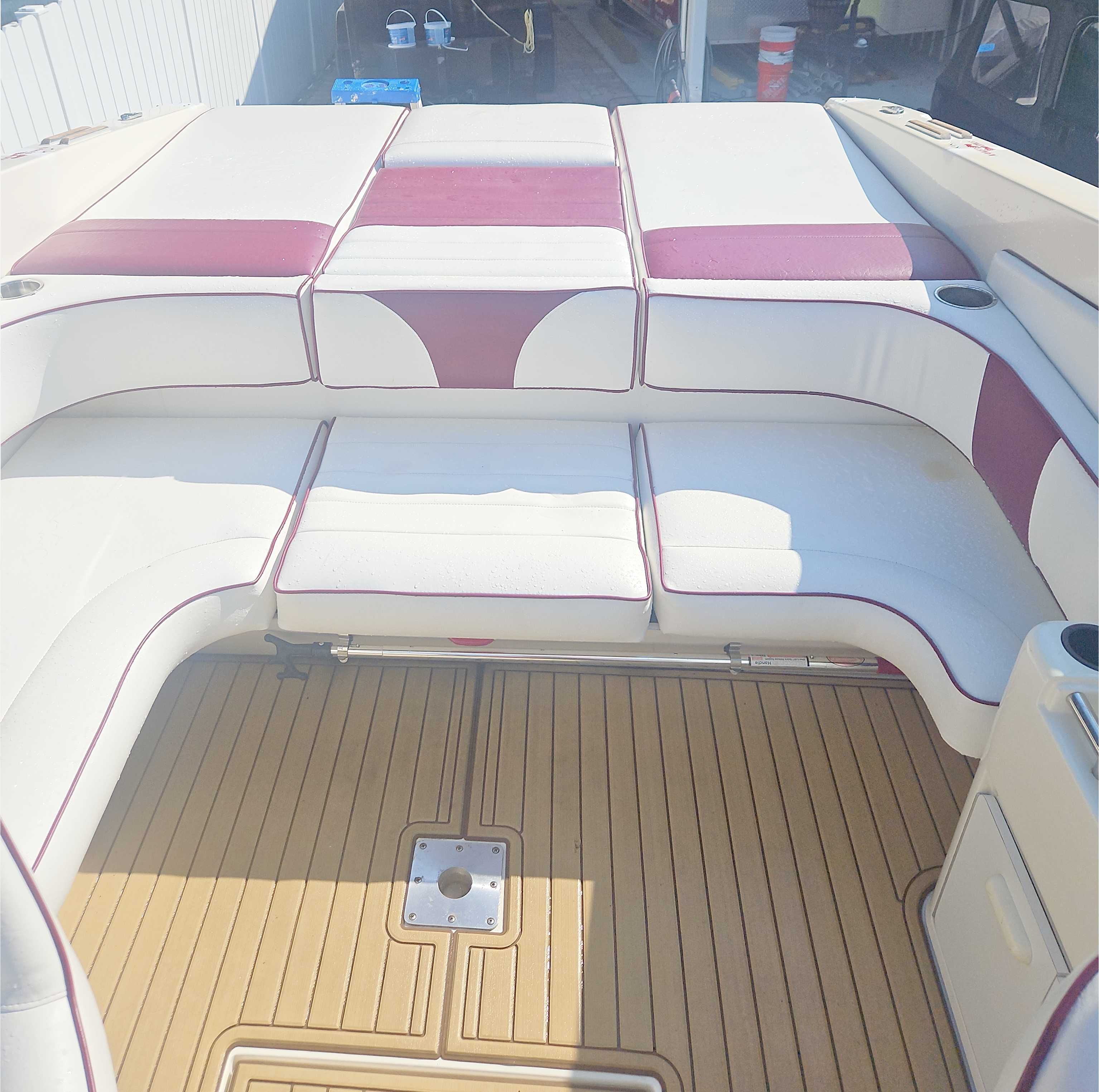 The image shows the cockpit of a 1989 Sea Ray 260 Overnighter with cushioned seating.