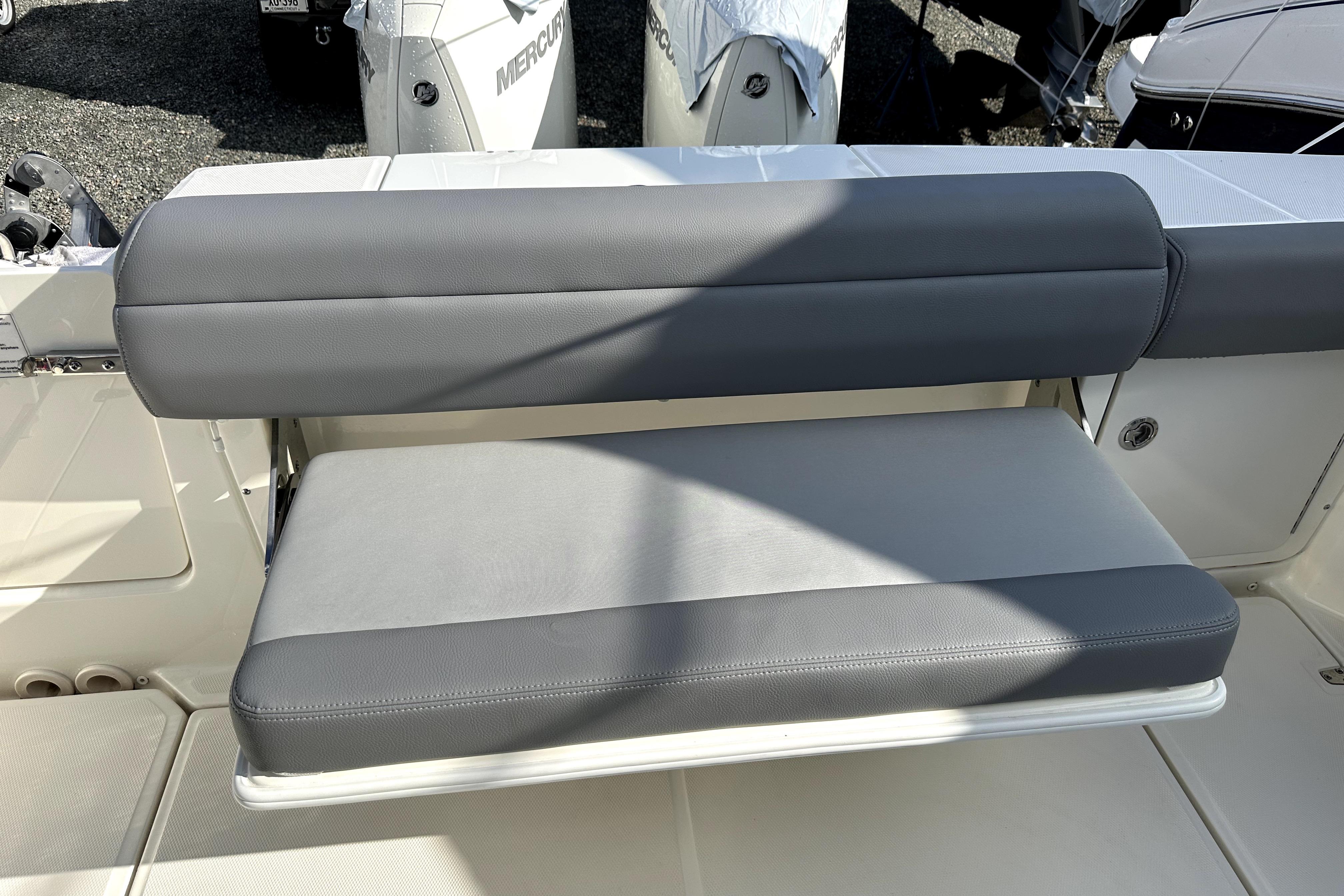 2023 Boston Whaler OUTRAGE boat seat with gray upholstery and sleek design.