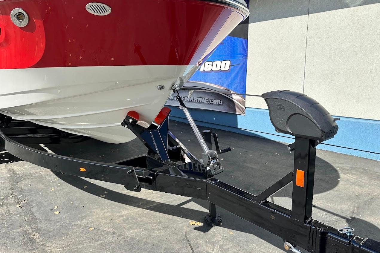 2026 Sea Ray SDX 230 Surf boat on trailer, red and white hull.