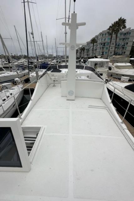 Bracewell 41 yacht deck, 2025 model, docked in a marina with surrounding boats.