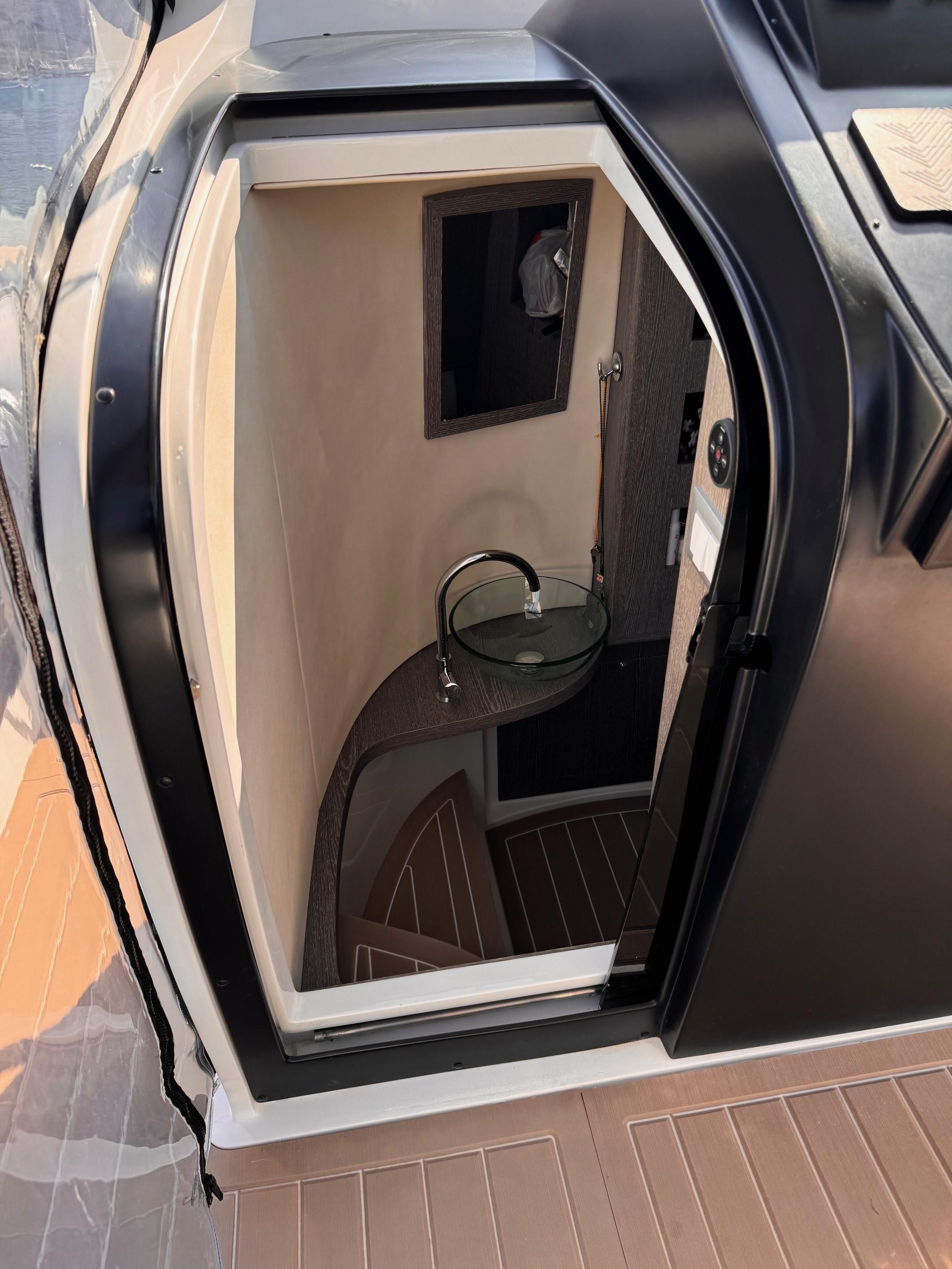 Interior view of 2020 Tecnorib PIRELLI PZERO 14 MT boat cabin with modern design.