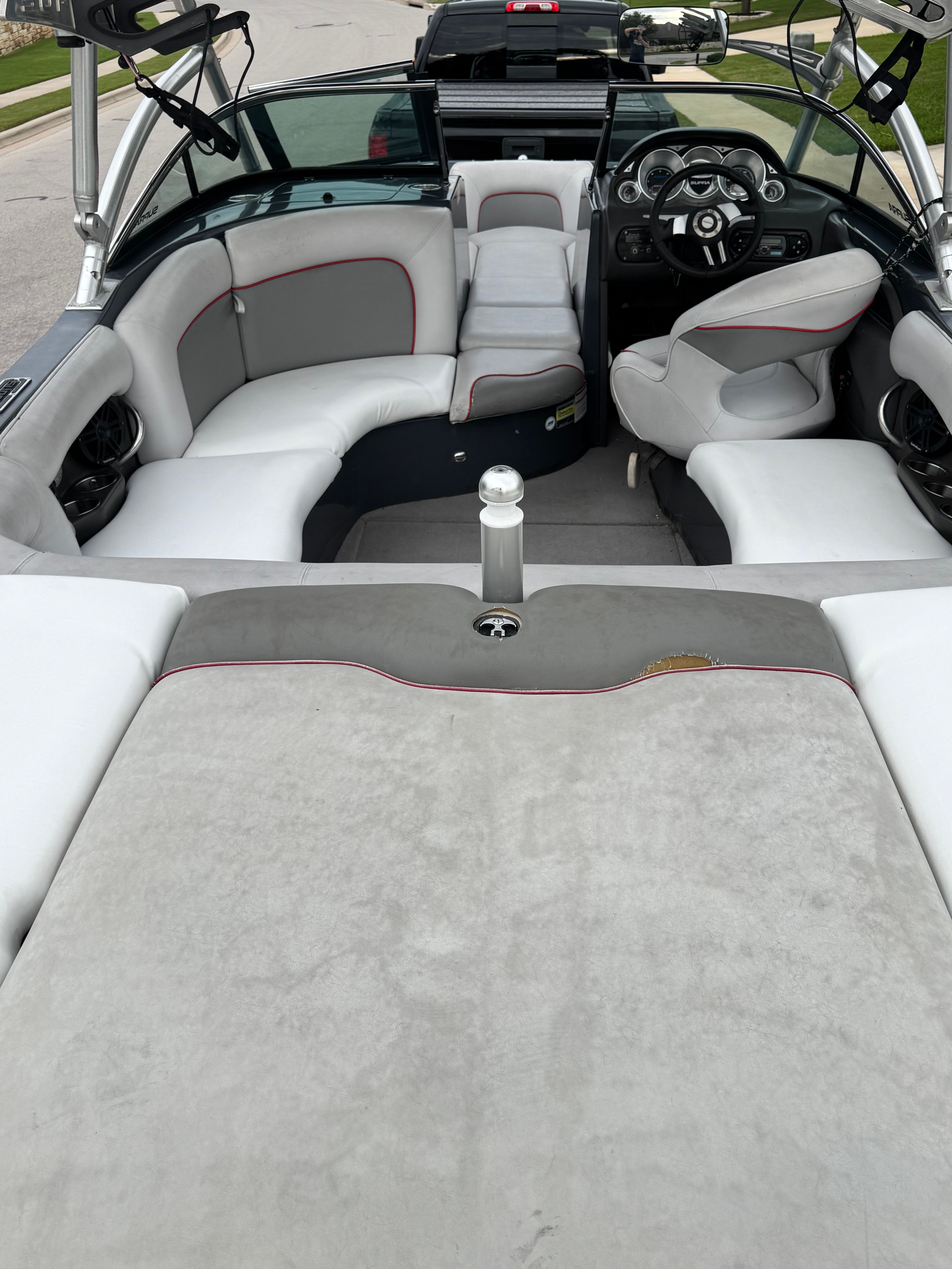 Interior of a 2008 Supra Launch 21 V with gray and white seating.
