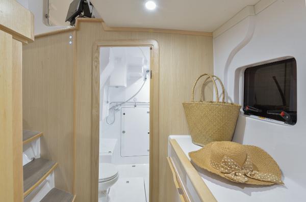 Interior of 2025 Seawind 1170 yacht with bathroom, stairs, and accessories.