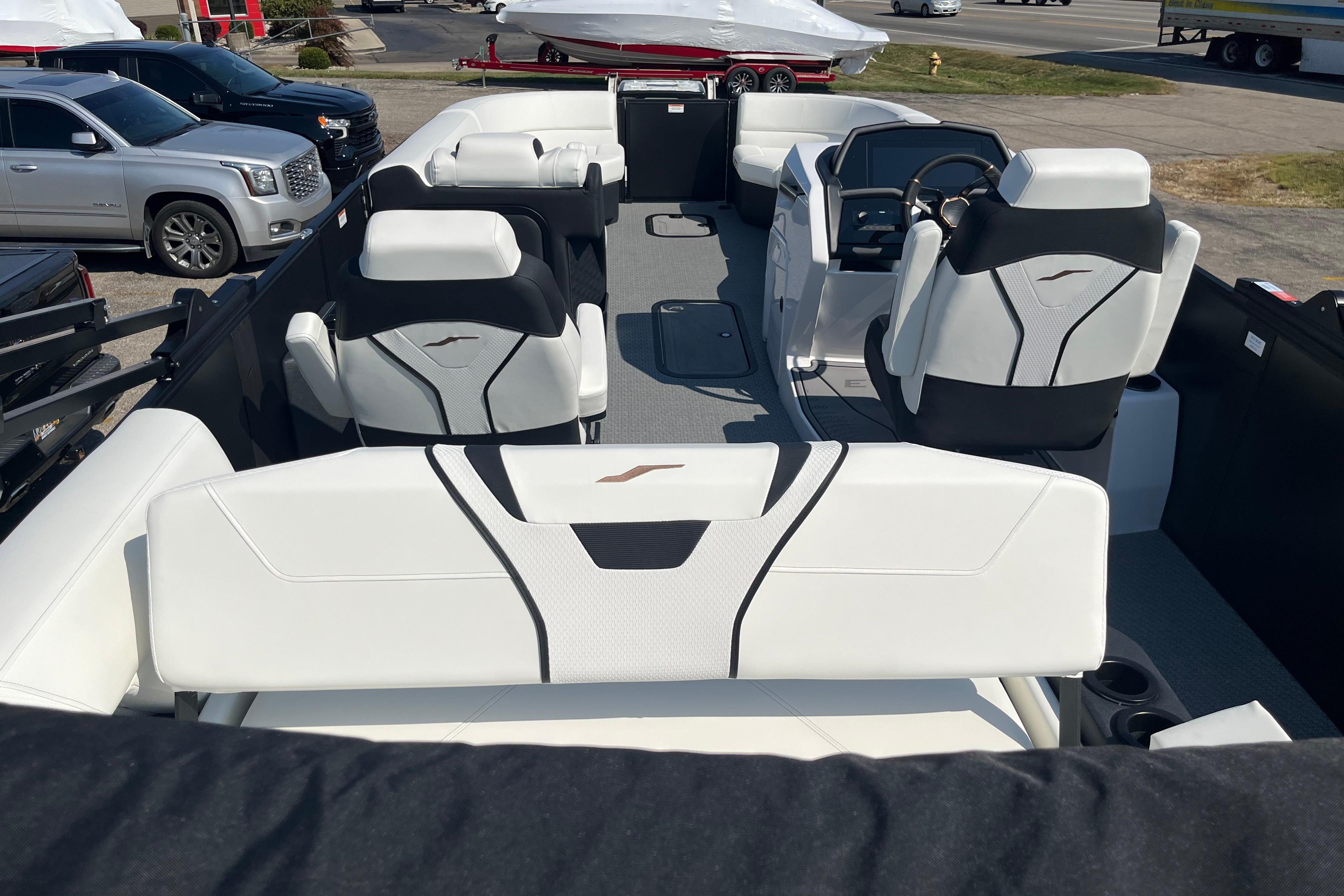 Interior of 2026 Evotti 725CS boat with modern seating and steering console.