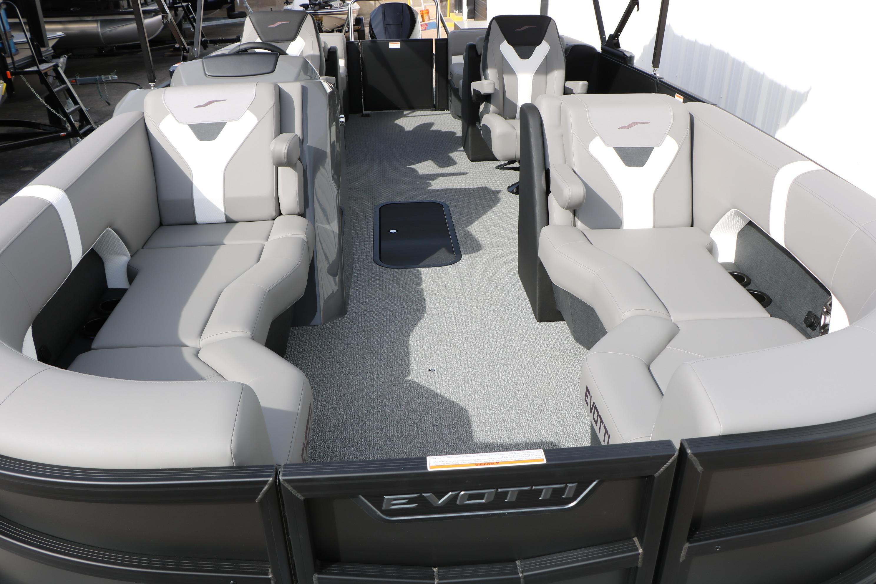Luxurious 2026 Evotti 521QL pontoon boat interior with plush seating and modern design.