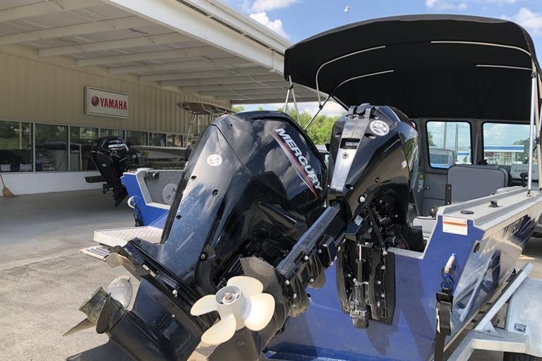 2023 Alumaweld Talon 18 boat with dual Mercury outboard motors at a Yamaha dealership.