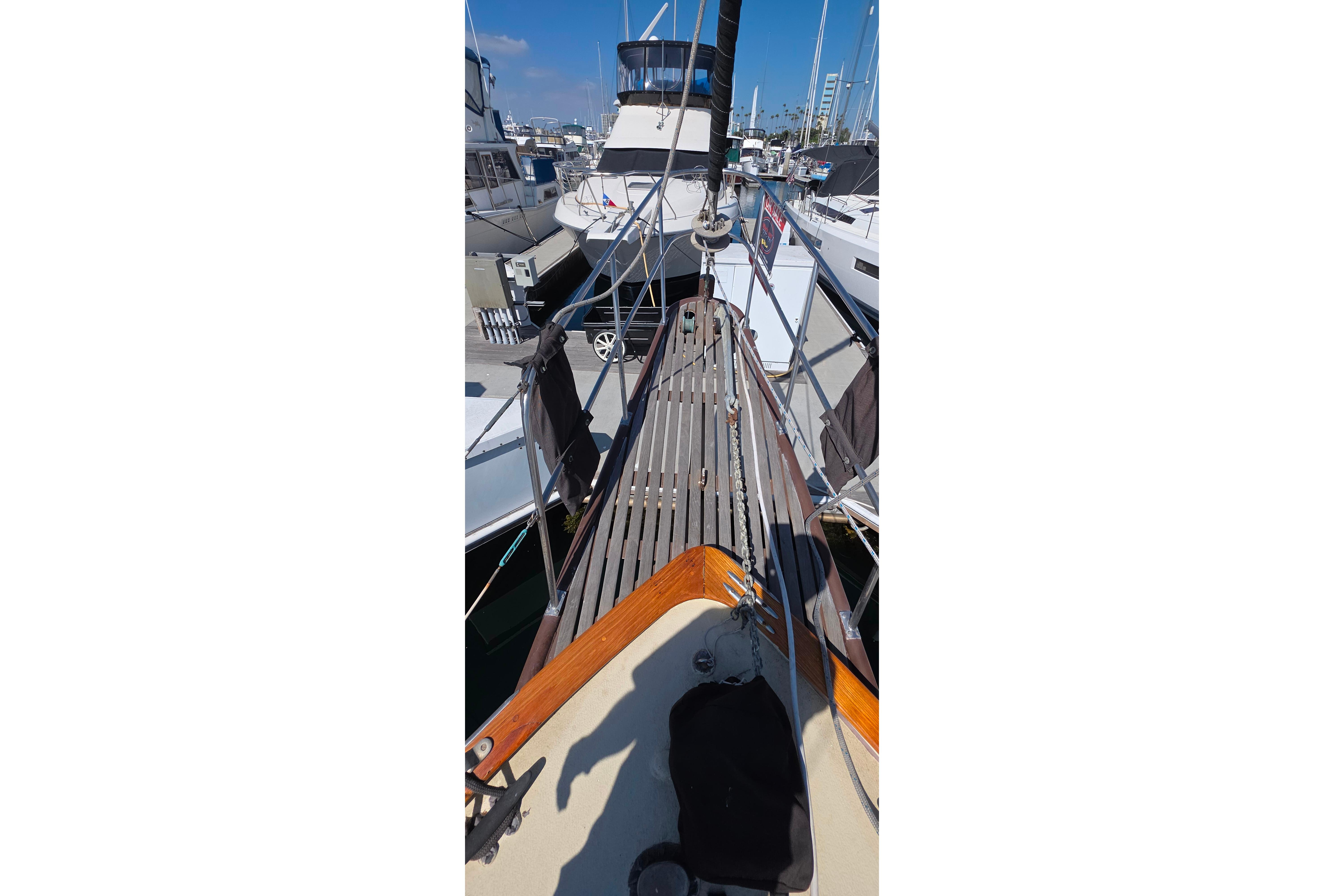 1978 Islander Freeport 41 sailboat docked at marina, showcasing deck and rigging.