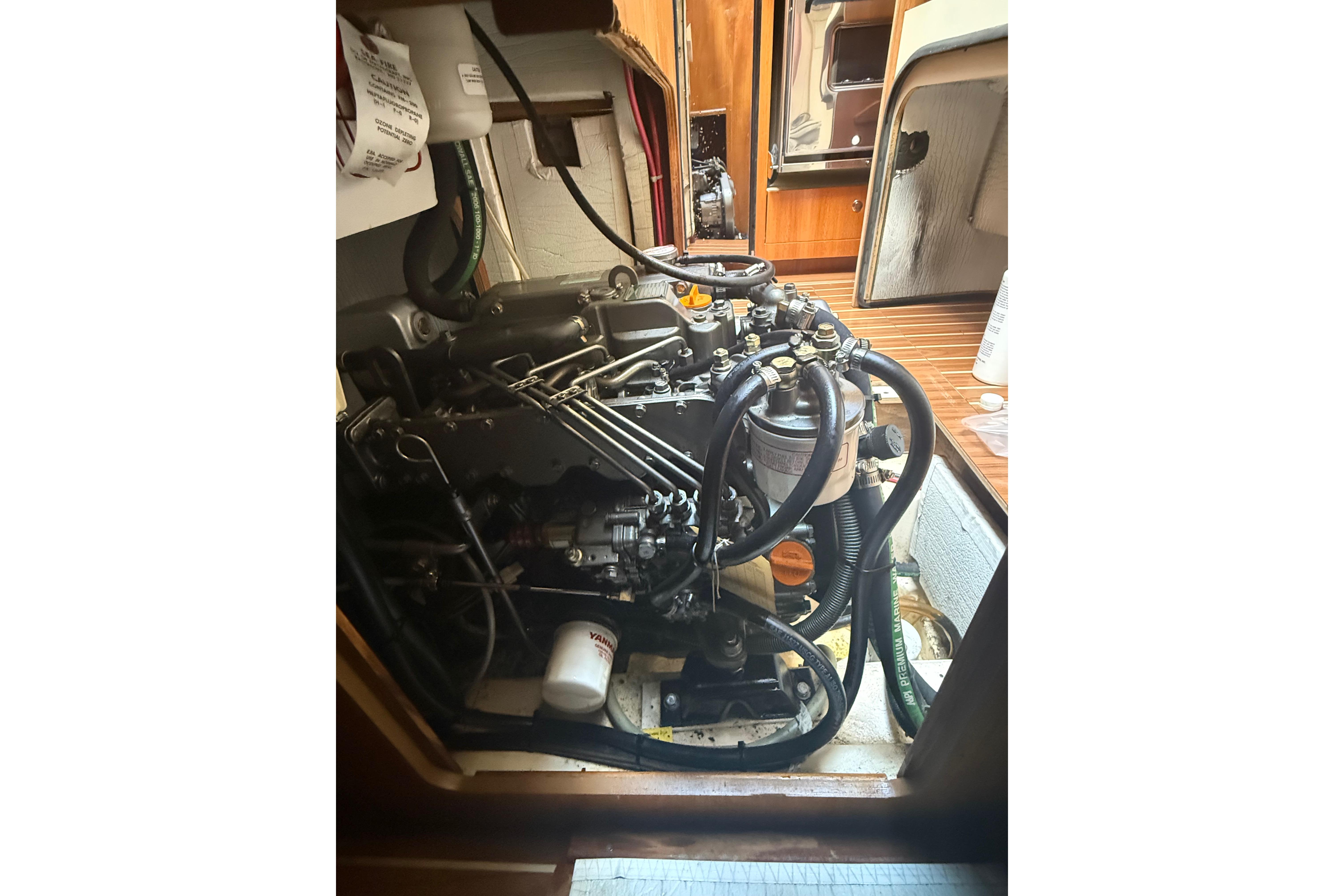 Engine compartment of a 2007 Hunter 41 Deck Salon sailboat, showcasing mechanical components.