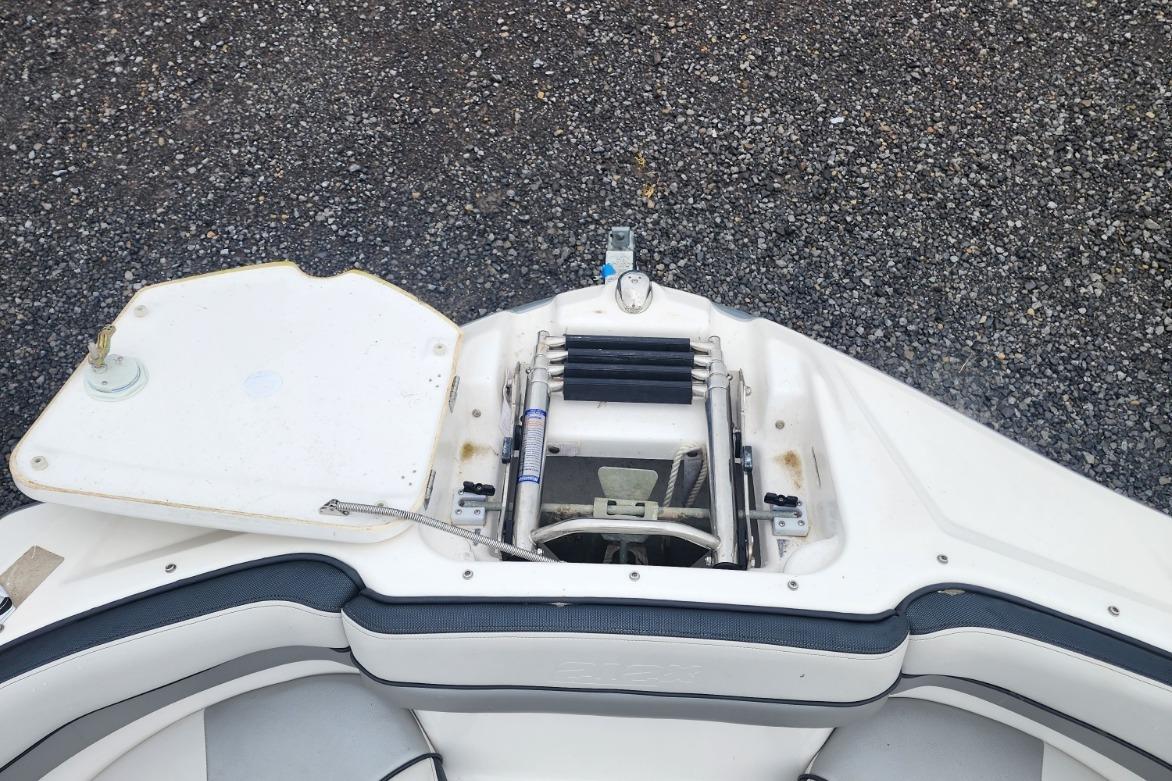 2015 Yamaha Boats 212X bow area with open anchor compartment.
