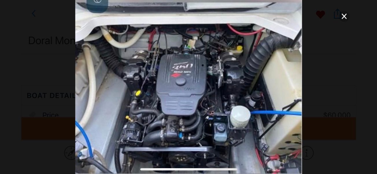 Engine compartment of a 2007 Doral Monticello with a clean engine and hoses.