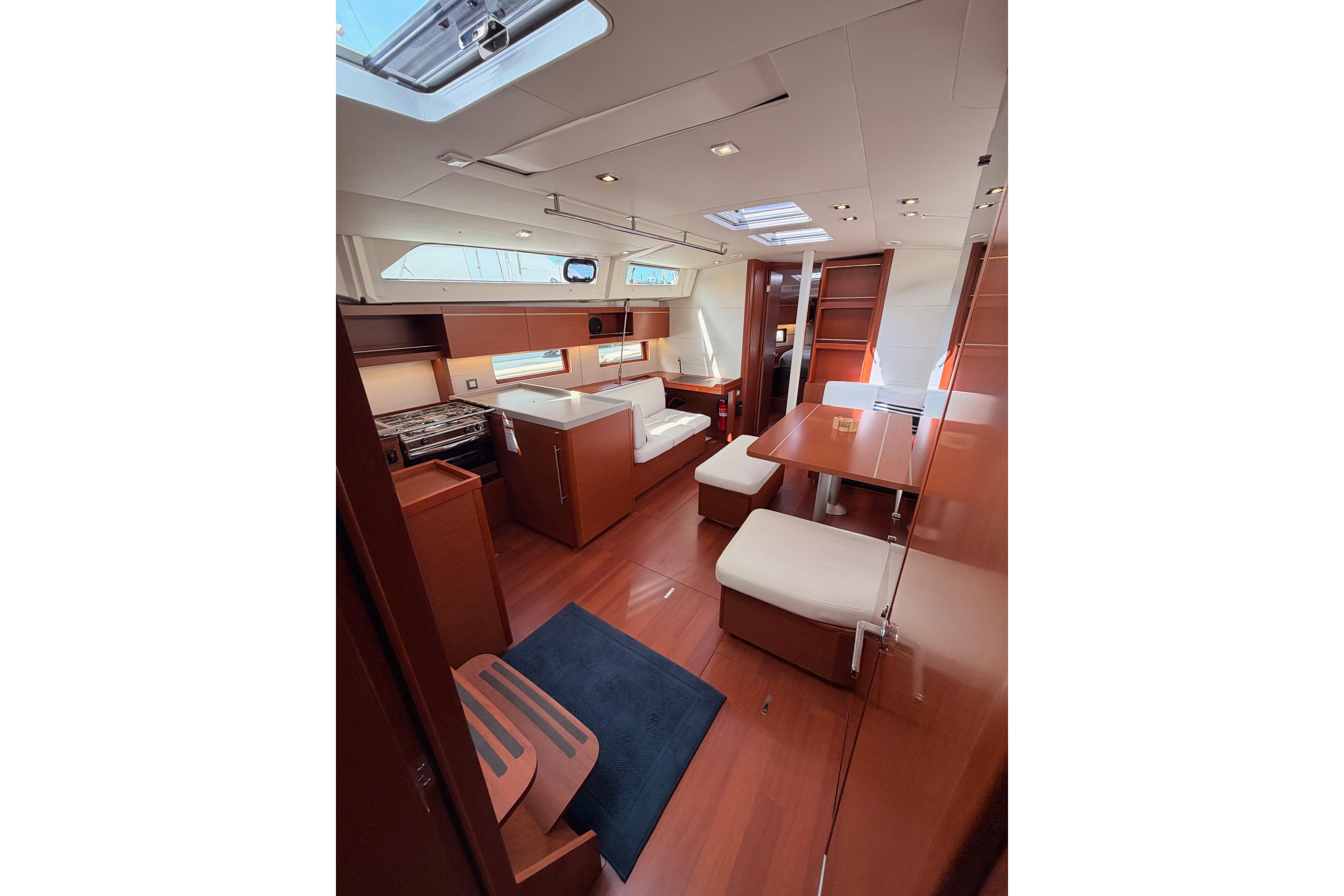 Interior of 2020 Beneteau Oceanis 46.1 yacht, featuring elegant wood finishes and modern design.