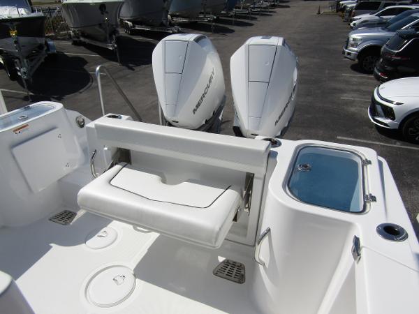 2024 Wellcraft 263 Fisherman boat with dual Mercury engines and foldable seating.