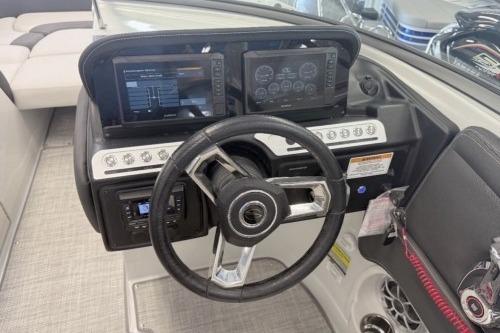 2026 Crownline Eclipse E255 boat dashboard with dual displays and steering wheel.