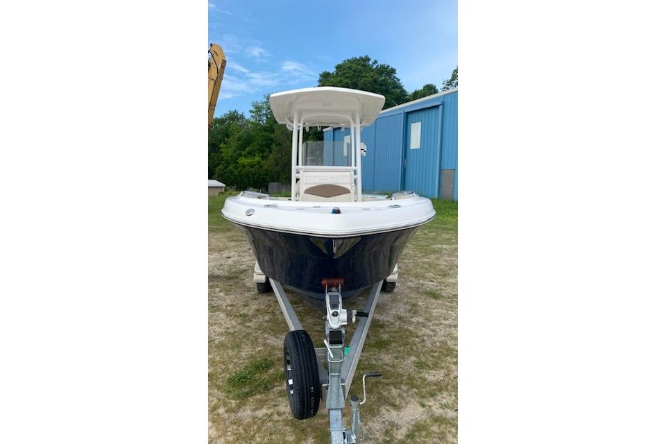 2017 Robalo R222 Center Console boat on trailer, parked outdoors.