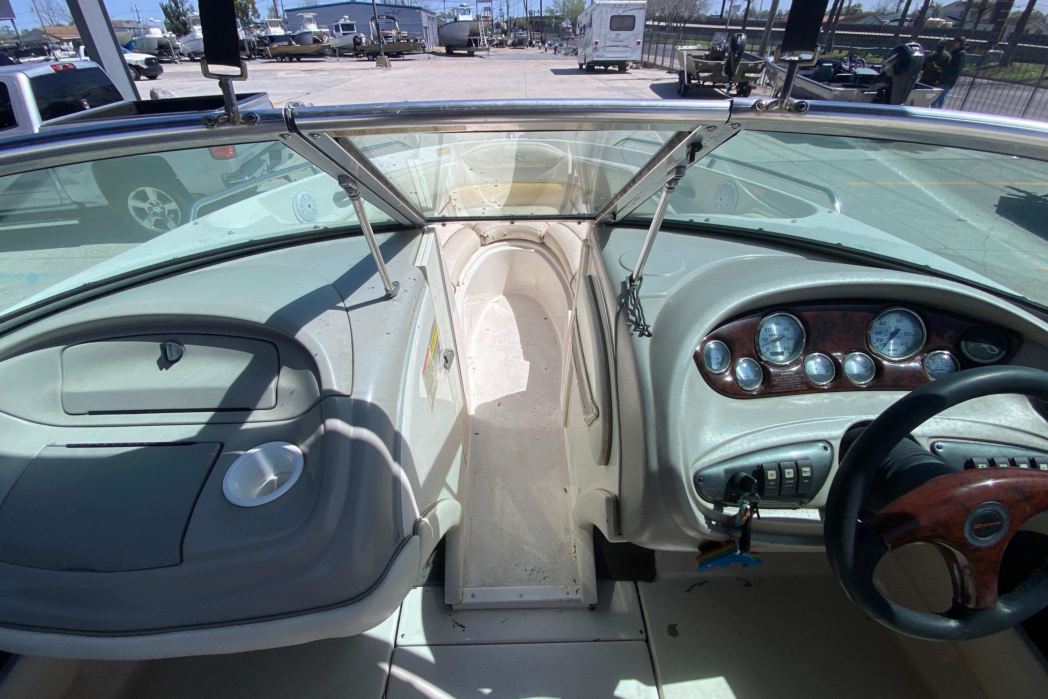 2003 Monterey 208SI Montura boat dashboard with steering wheel and instrument panel.