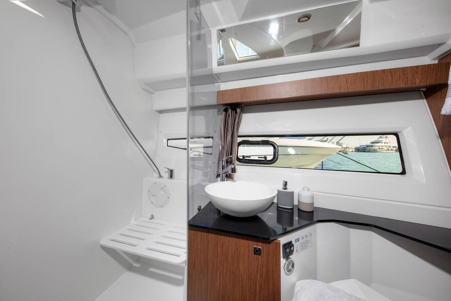 Manufacturer Provided Image: 2020 Jeanneau NC 1095 boat bathroom with modern fixtures and sea view.