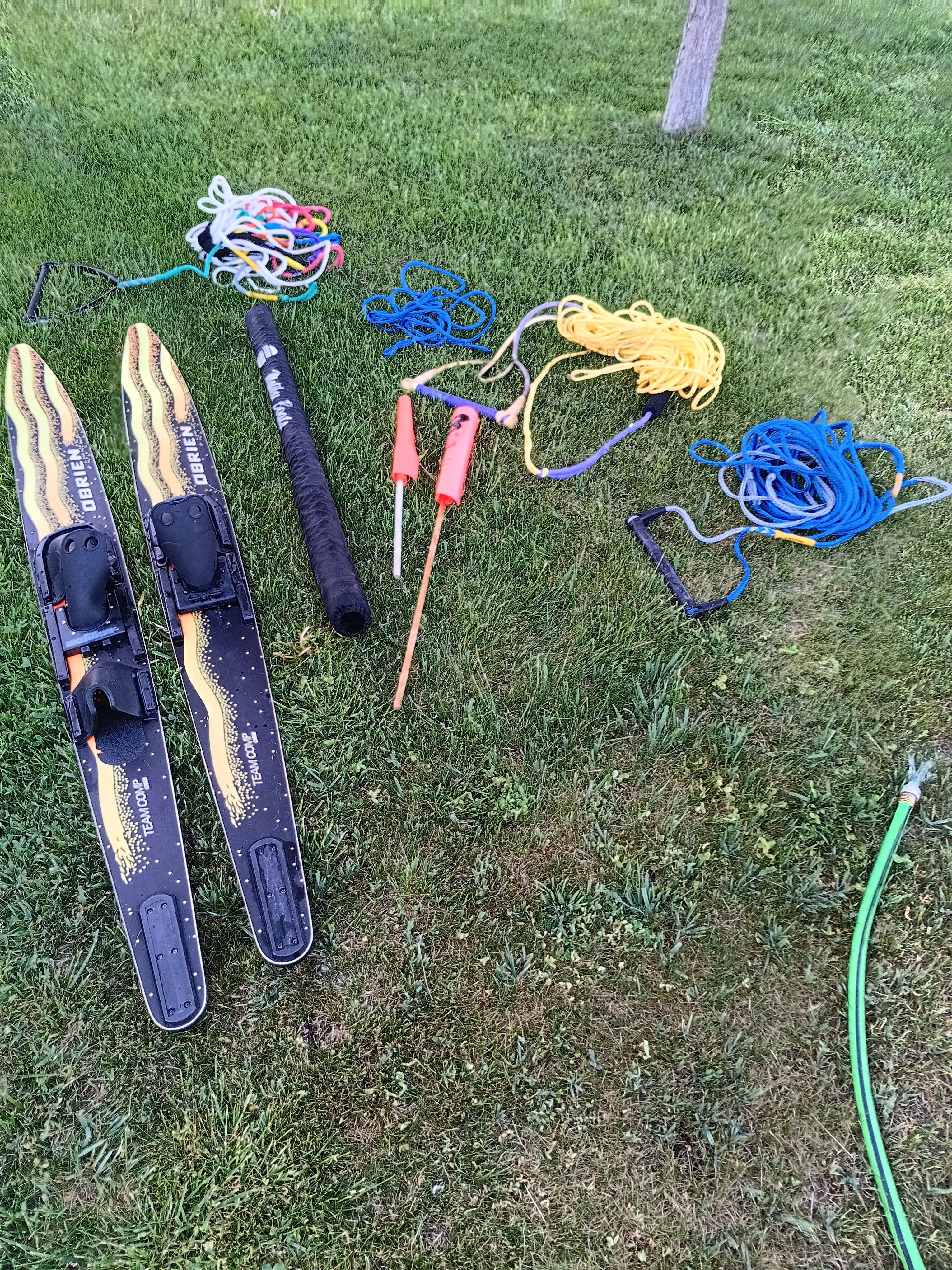 Water skiing gear on grass with ropes and accessories, Malibu Skier 1991.